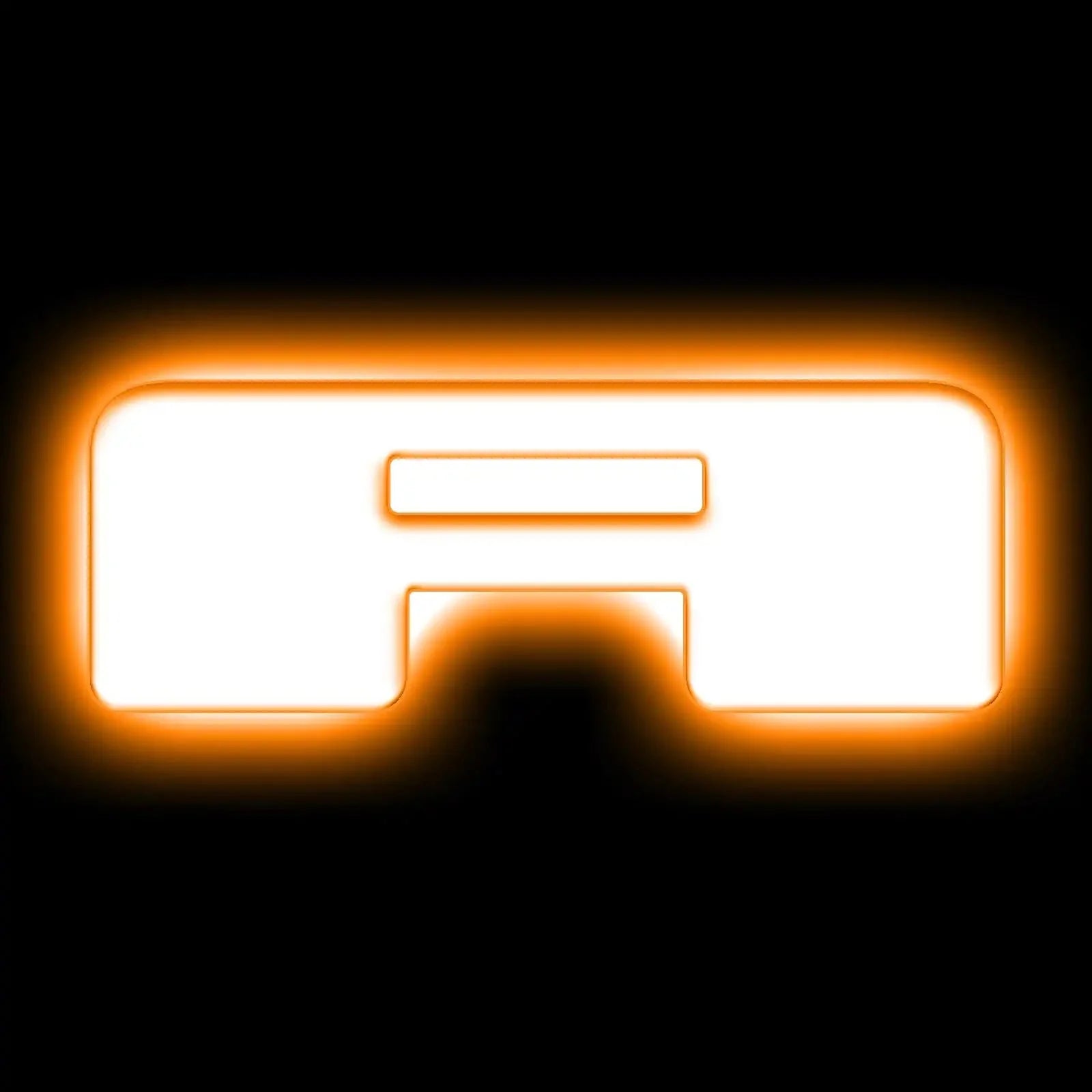 Orange LED backlit trim piece for vehicle grille or accessory, glowing on black background