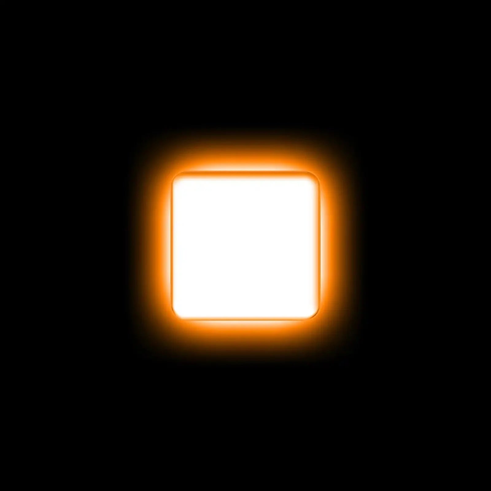 Square white LED light illuminated with amber backlight, on black background, for off-road vehicles.