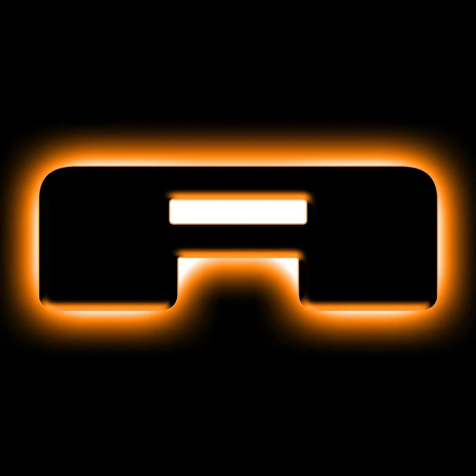 orange LED backlit grille badge for Toyota Tacoma or 4Runner, glowing in dark
