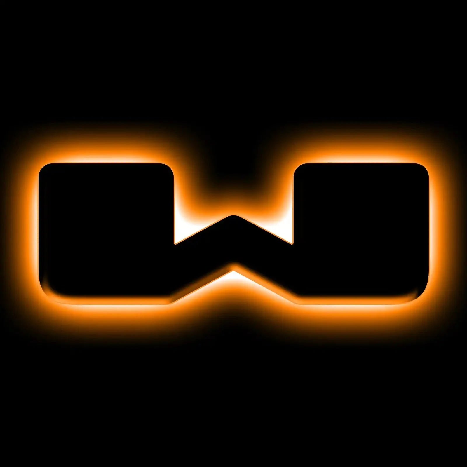 Rectangular W-shaped emblem with orange LED backlight on black background, vehicle accessory