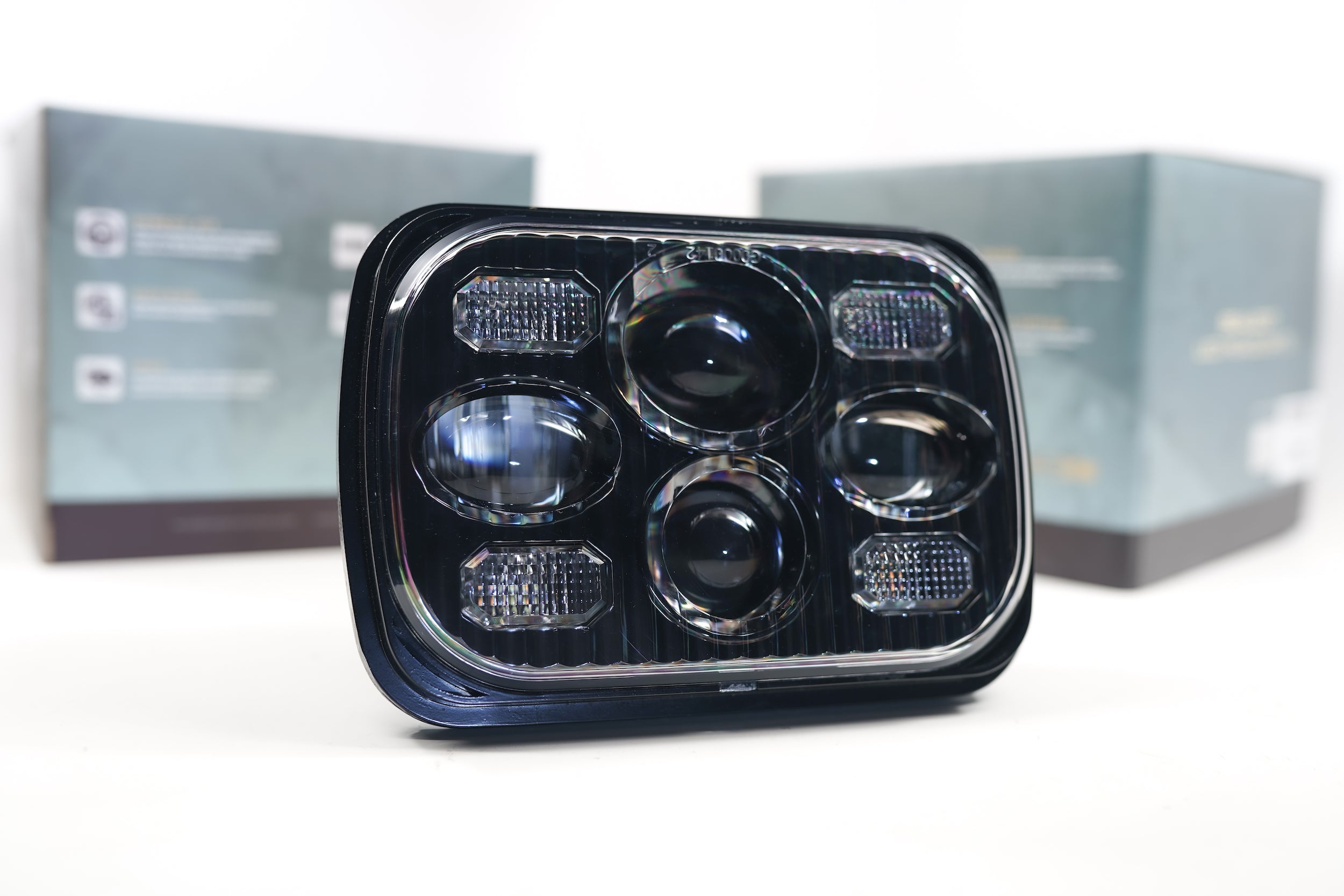 Rectangular Bi-LED 5x7 headlight for off-road vehicles with clear lens and multi-projector design