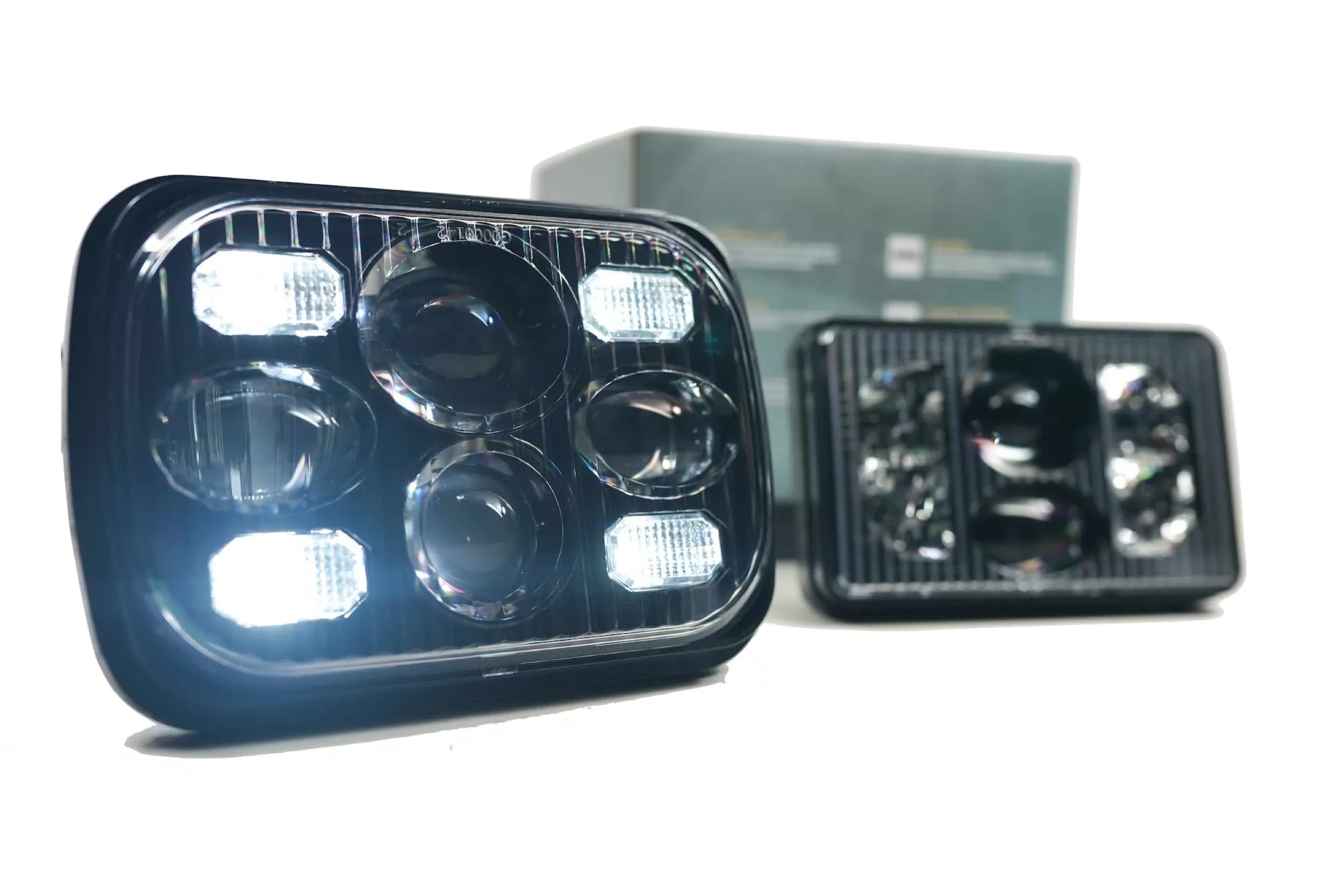 Rectangular 5x7 LED headlights with multiple projector lenses, ideal for off-road vehicles.