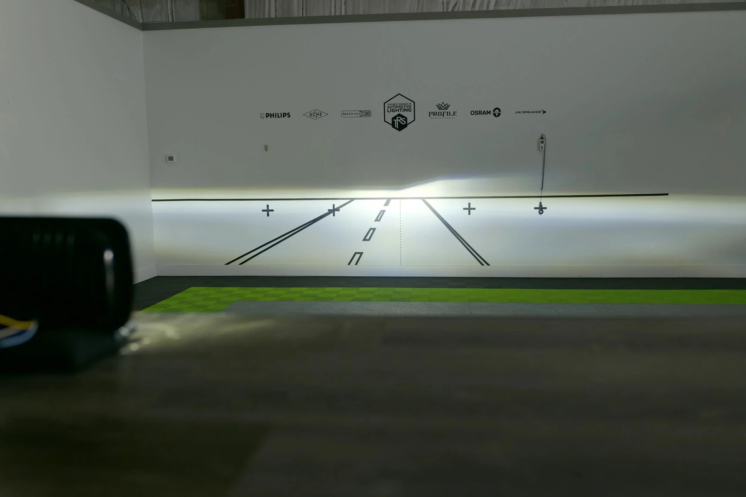 Bi-LED 5x7 headlight beam pattern test against white wall in lighting lab