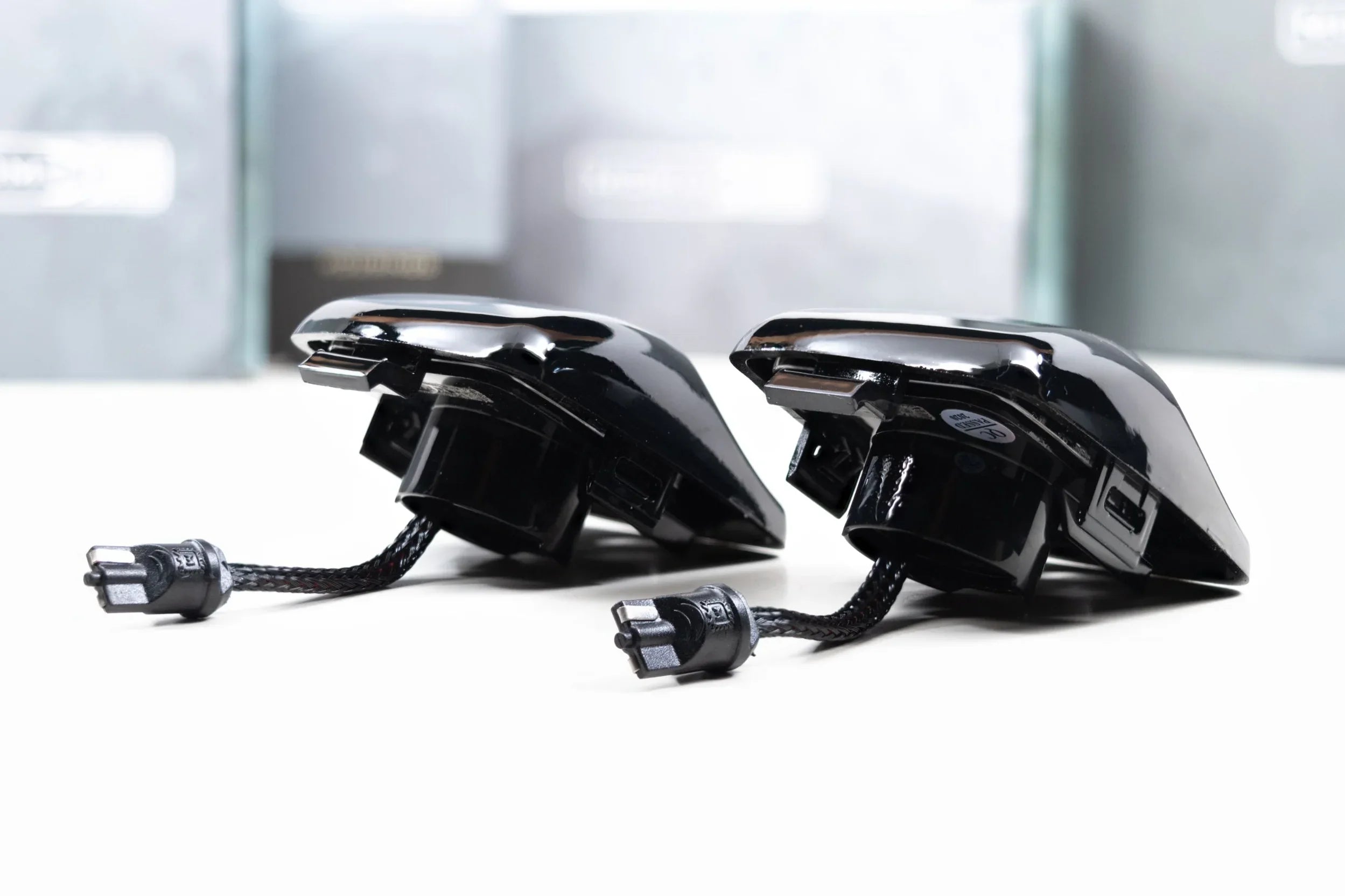 Pair of black LED license plate lights for Toyota Tacoma with wiring connectors