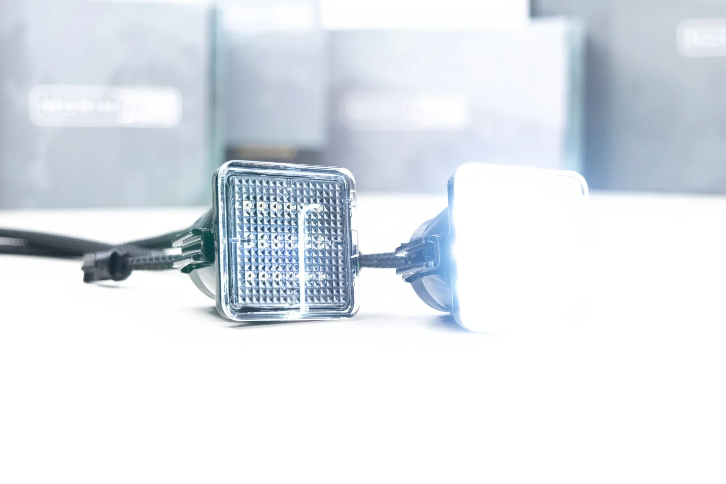 LED license plate lights for Toyota Tacoma, close-up with one light illuminated