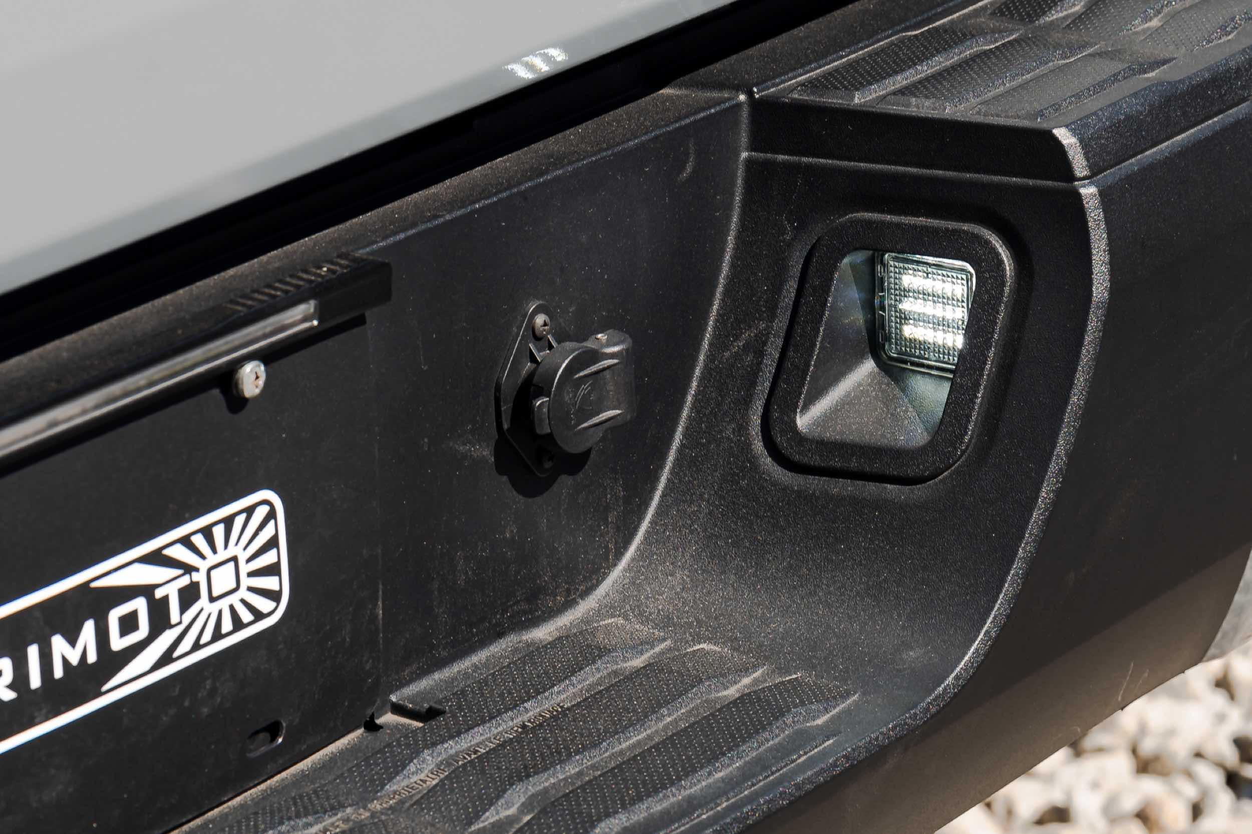 Toyota Tacoma rear bumper with integrated LED license plate light and trailer connector