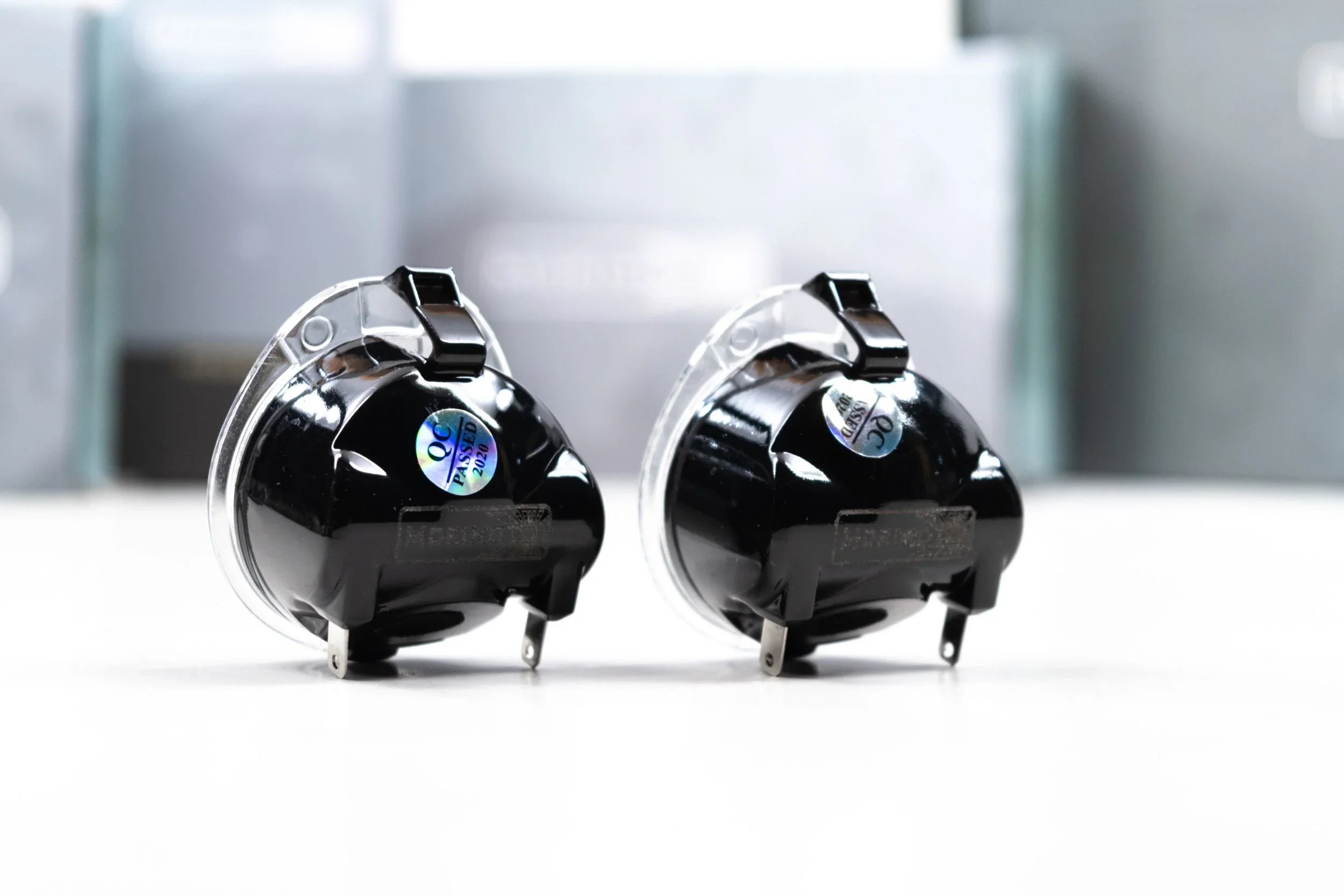 Pair of black aftermarket mirror lights for Toyota Tundra on white surface