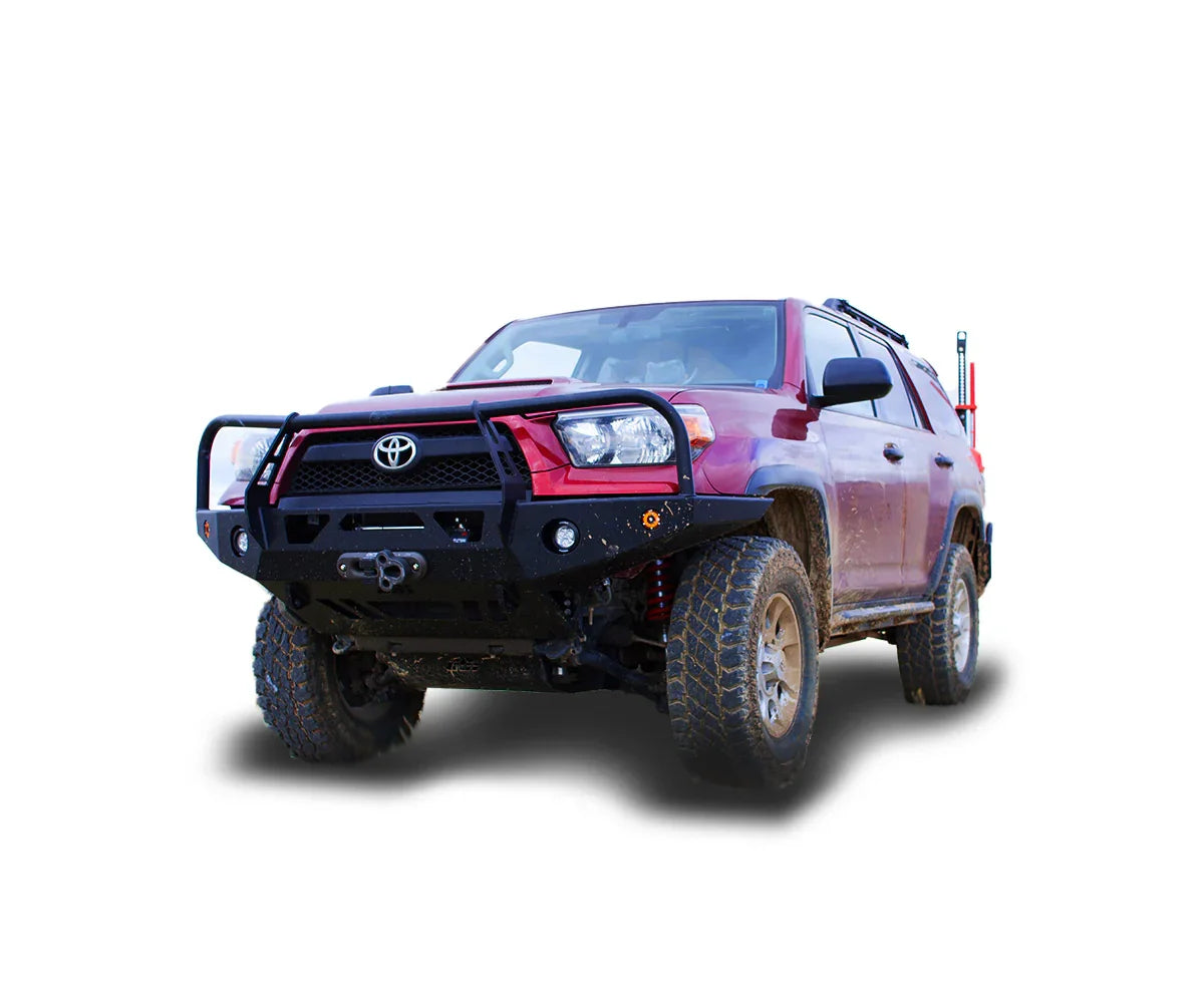 Red Toyota 4Runner with off-road bumper, mud tires, and overlanding gear