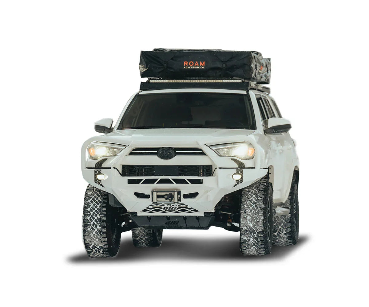 Toyota 4Runner with off-road tires and rooftop tent, adventure camping gear