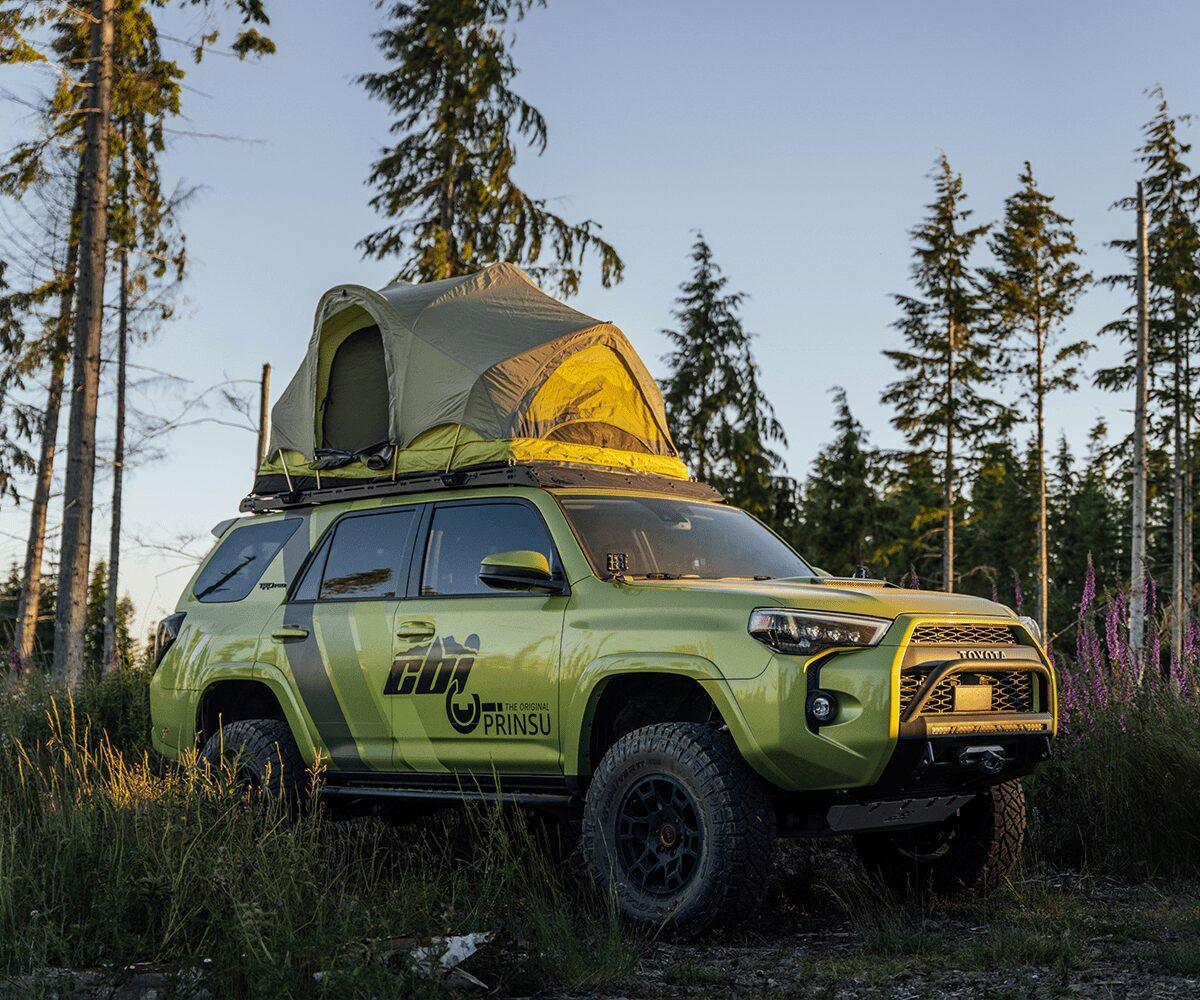Toyota 4Runner with roof top tent and Prinsu rack parked in Oregon forest