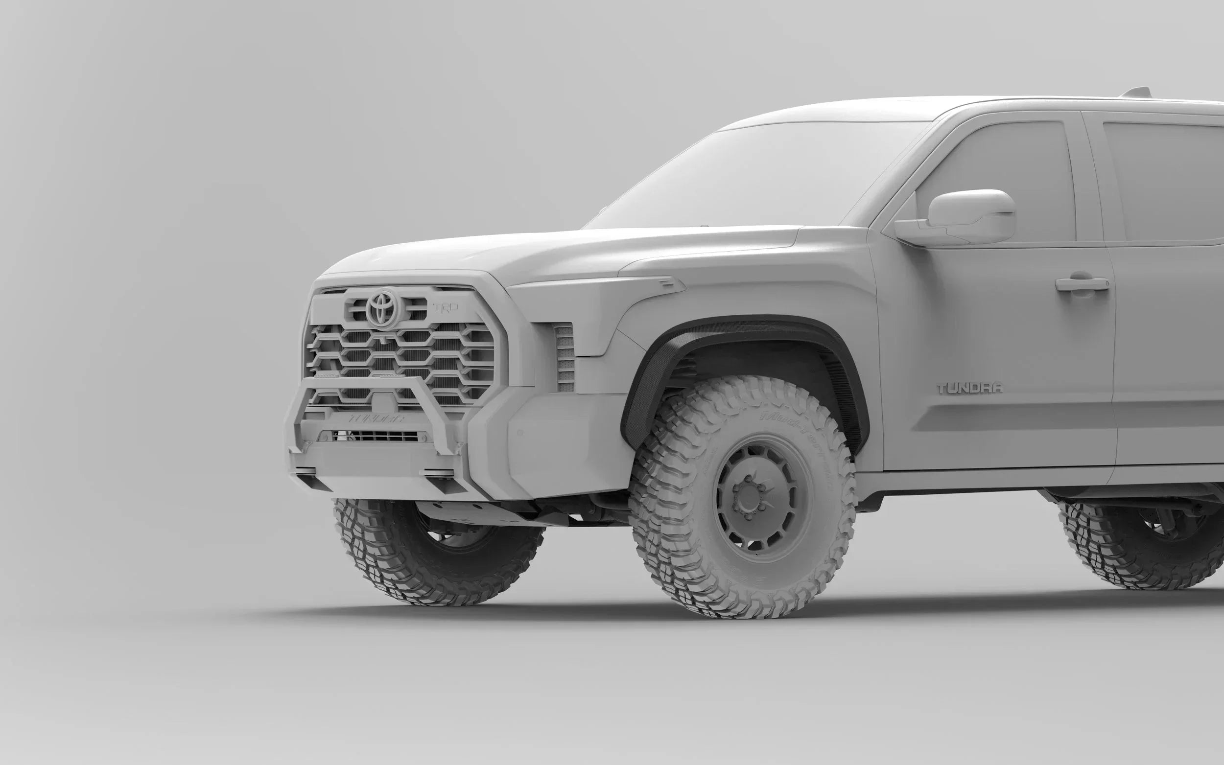 Toyota Tundra off-road truck with rugged front bumper and all-terrain tires, rendered in gray