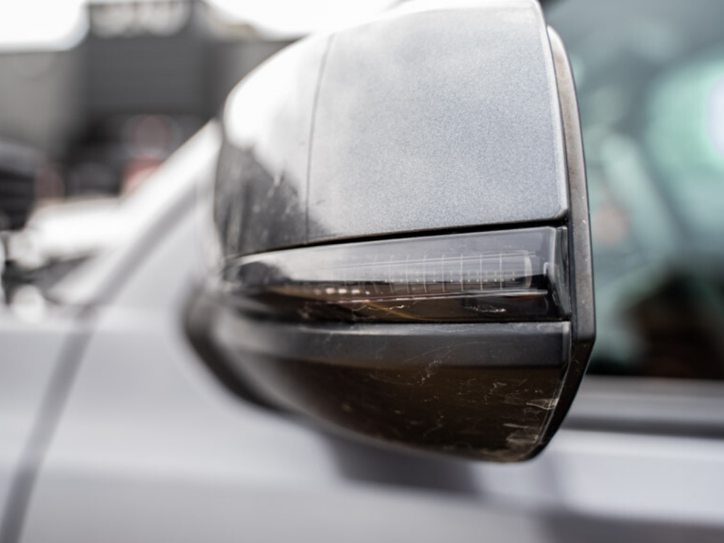 Close-up of a vehicle side mirror with integrated LED turn signal for off-road trucks or SUVs