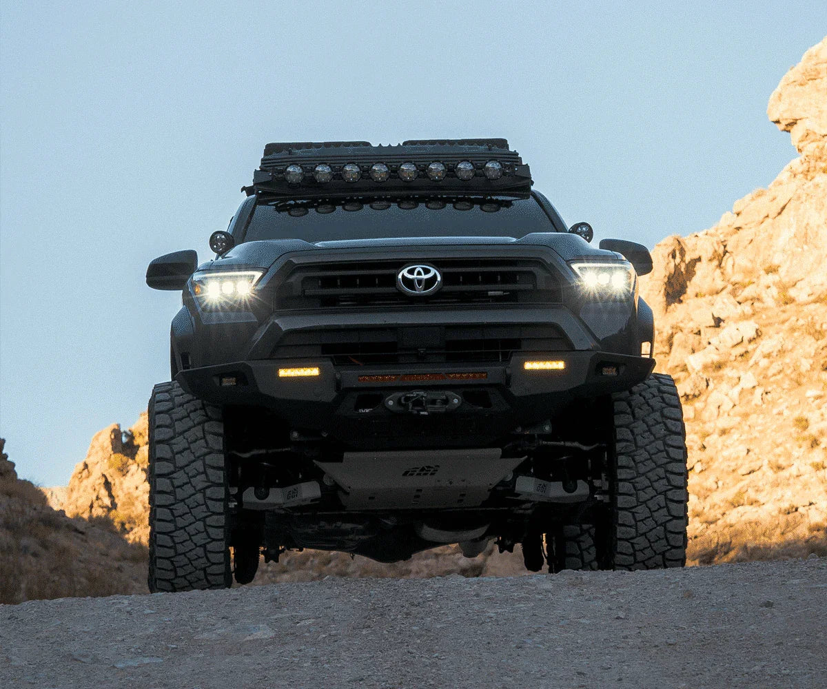 Lifted Toyota 4Runner with off-road accessories and LED lights on rocky terrain