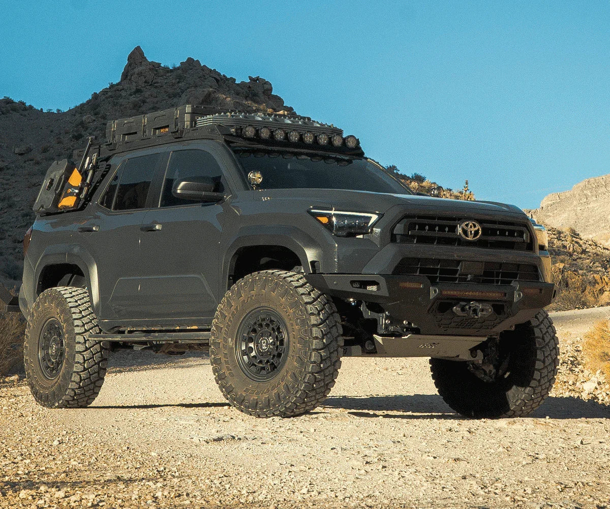 Toyota 4Runner outfitted with overlanding gear and off-road accessories on a rocky trail
