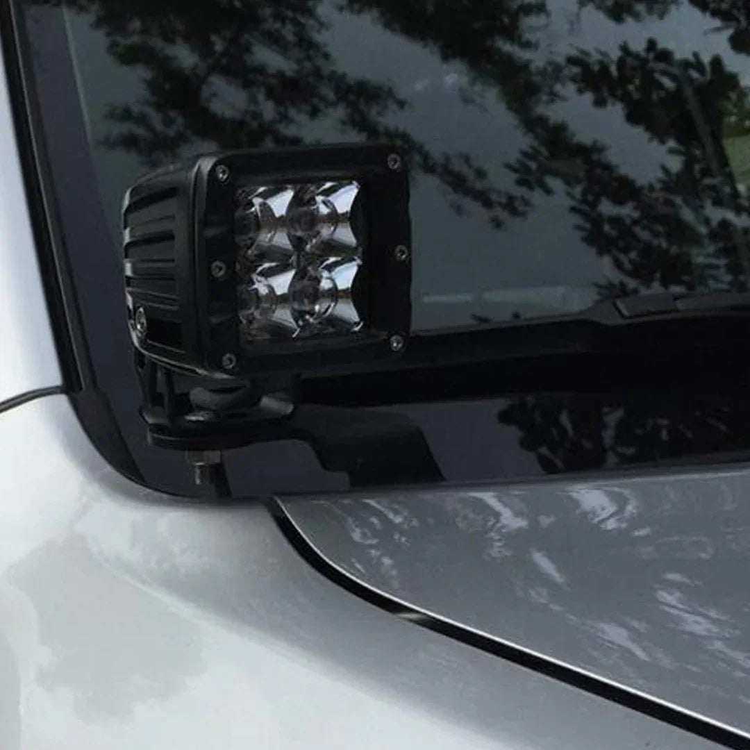 Ditch light bracket with LED light mounted on a 4th Gen Toyota 4Runner hood