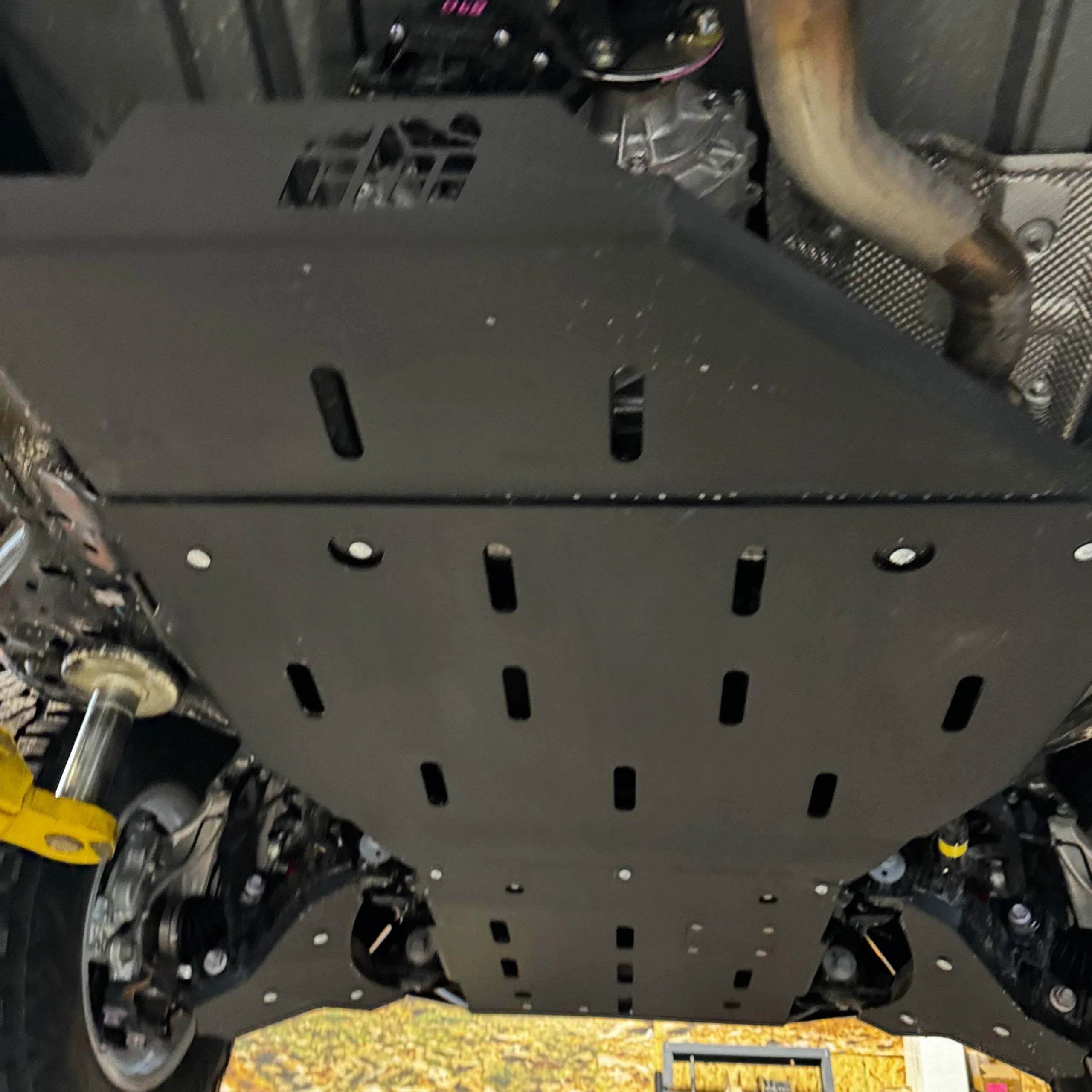 Heavy-duty rear skid plate installed on 4th gen Toyota Tacoma undercarriage