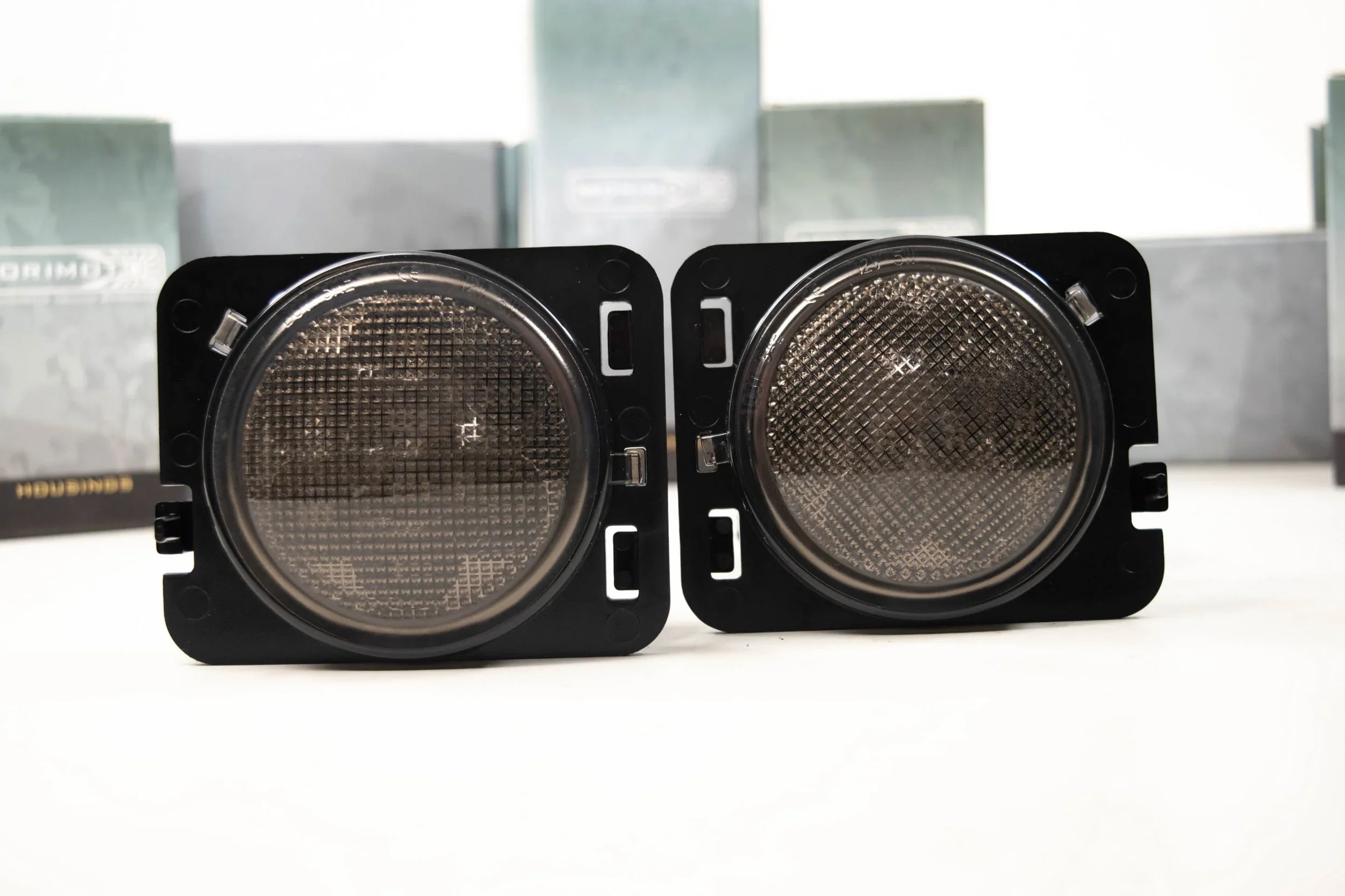 Pair of smoked lens parking lights for Jeep Wrangler JK on a white background