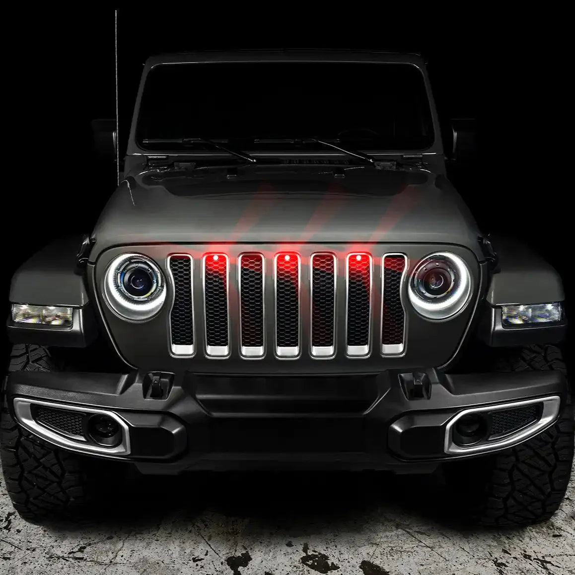 Jeep Wrangler front grille with red LED lights and aftermarket halo headlights