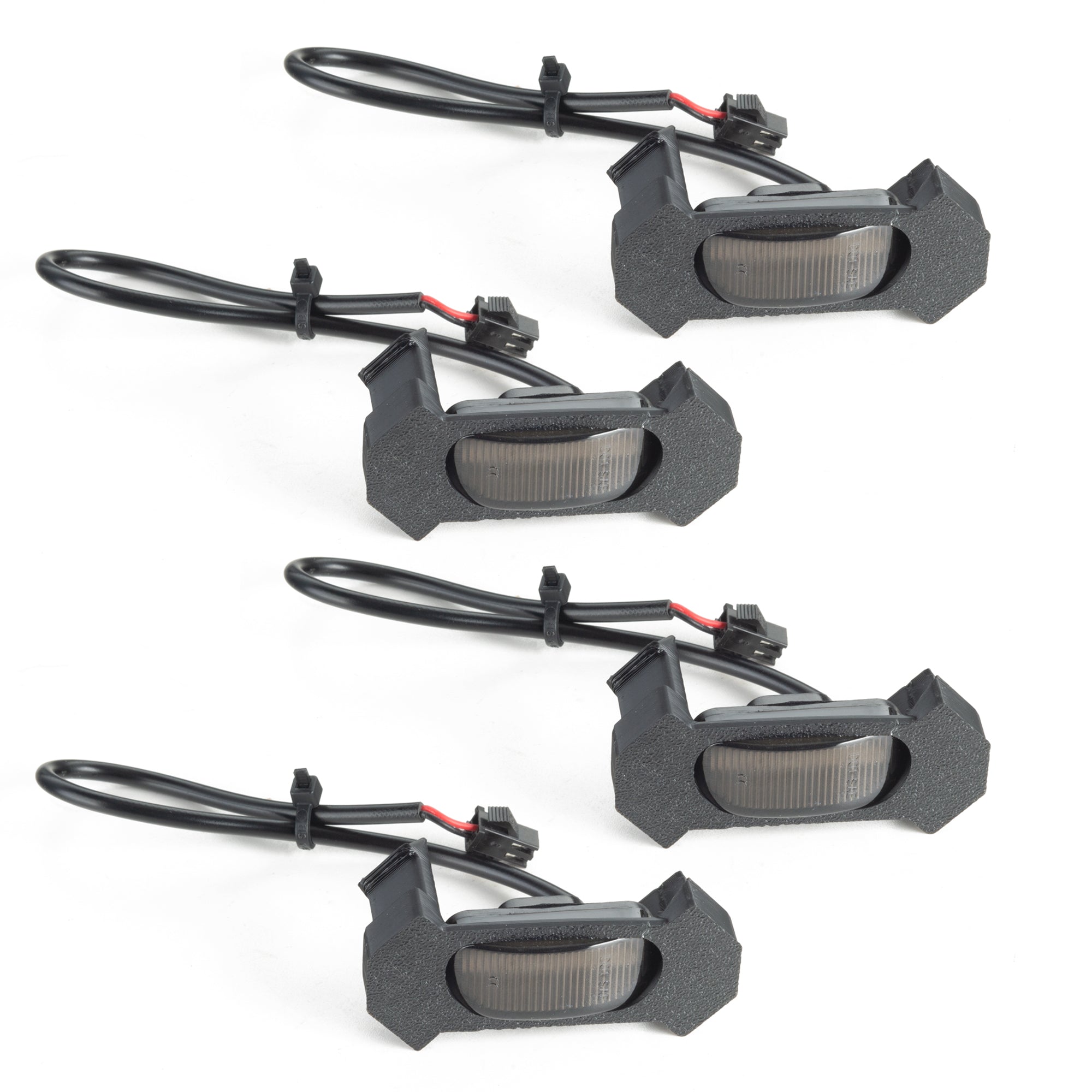 Set of four LED rock lights with wiring for off-road vehicles, ideal for overlanding trucks