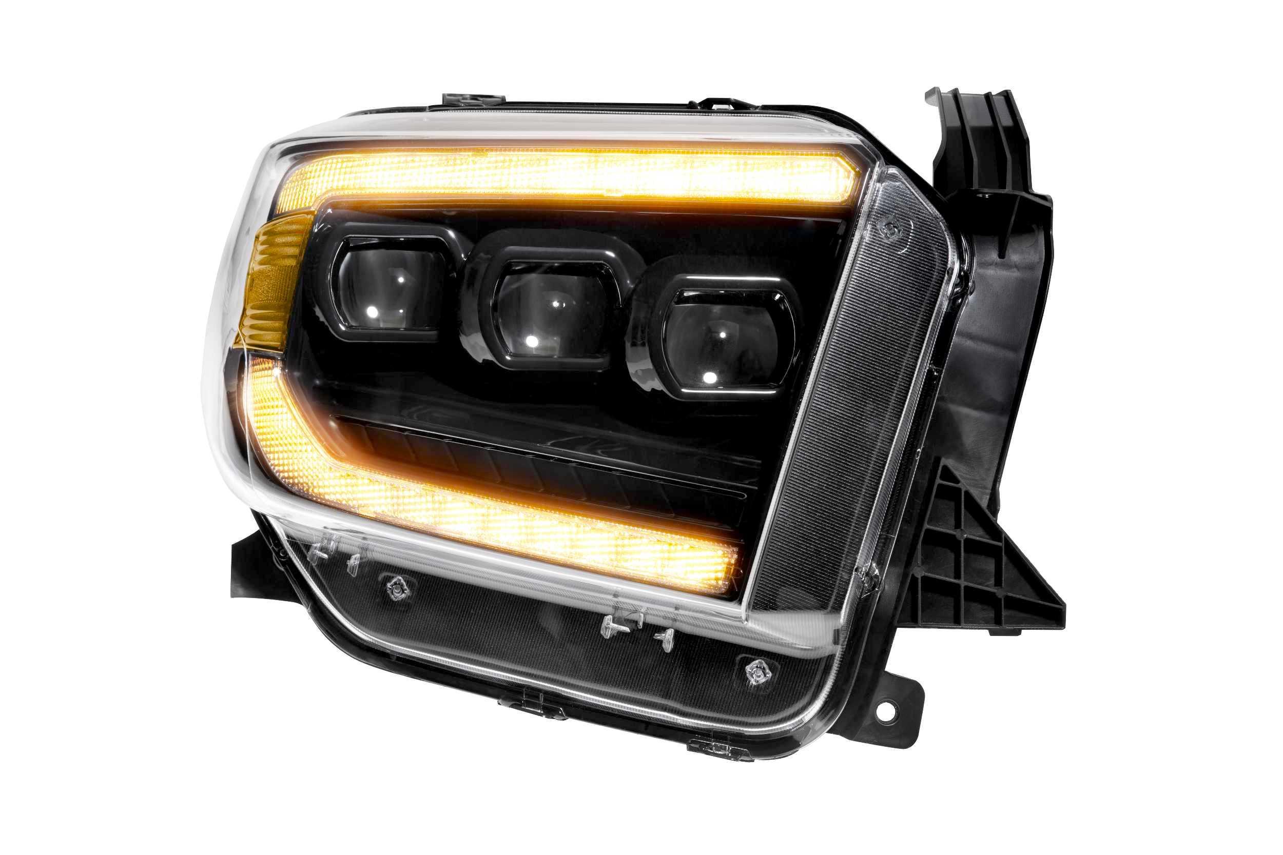 Toyota Tundra amber LED headlight assembly with black housing and triple projector design