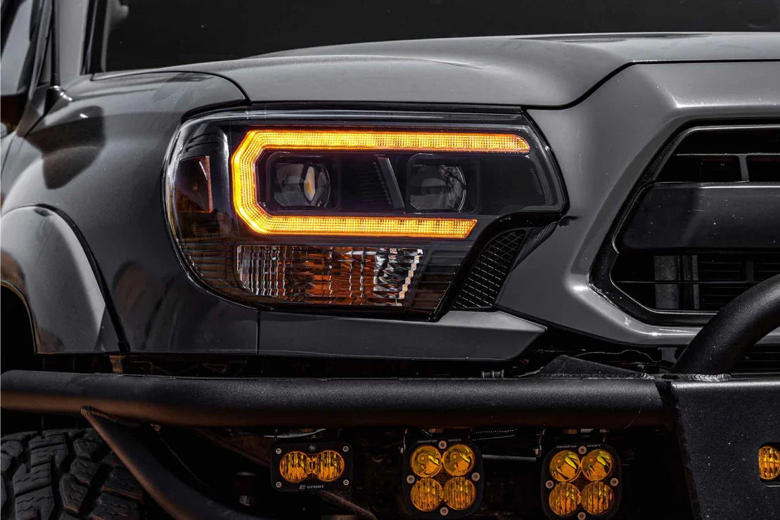 Toyota Tacoma with aftermarket amber hybrid LED headlights and off-road bumper lights