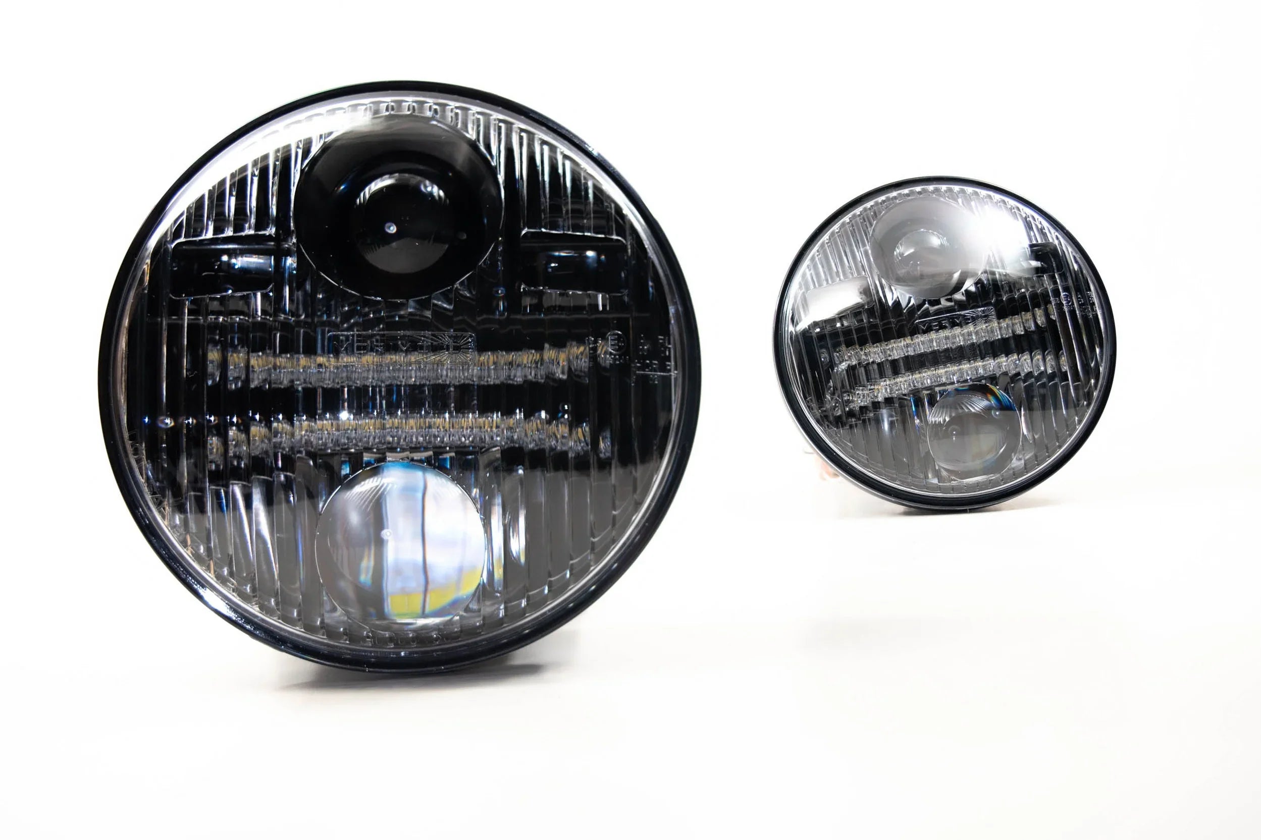 Round LED projector headlights for off-road vehicles on white background