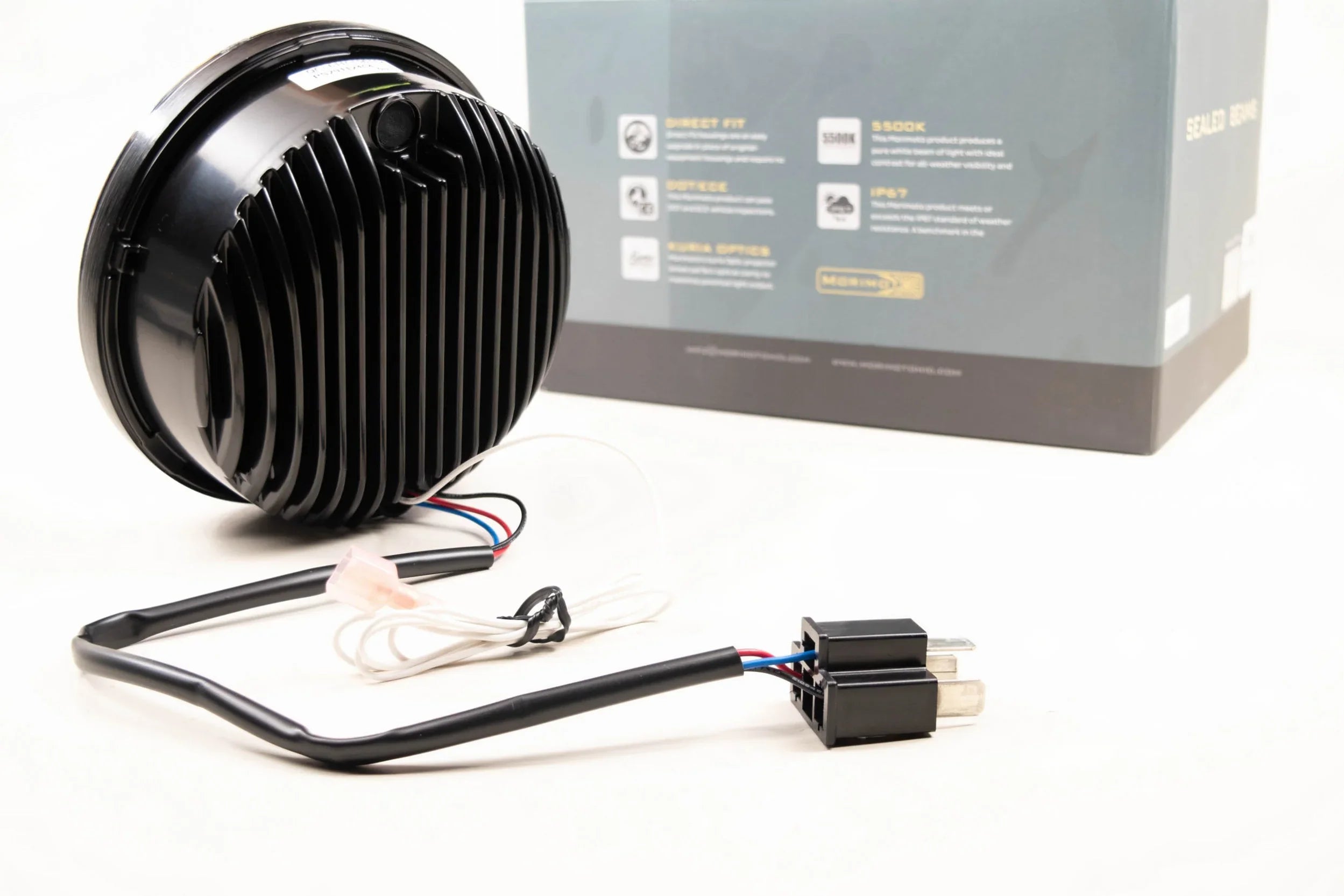 LED round headlight with black housing, wiring harness, and product box for off-road vehicles