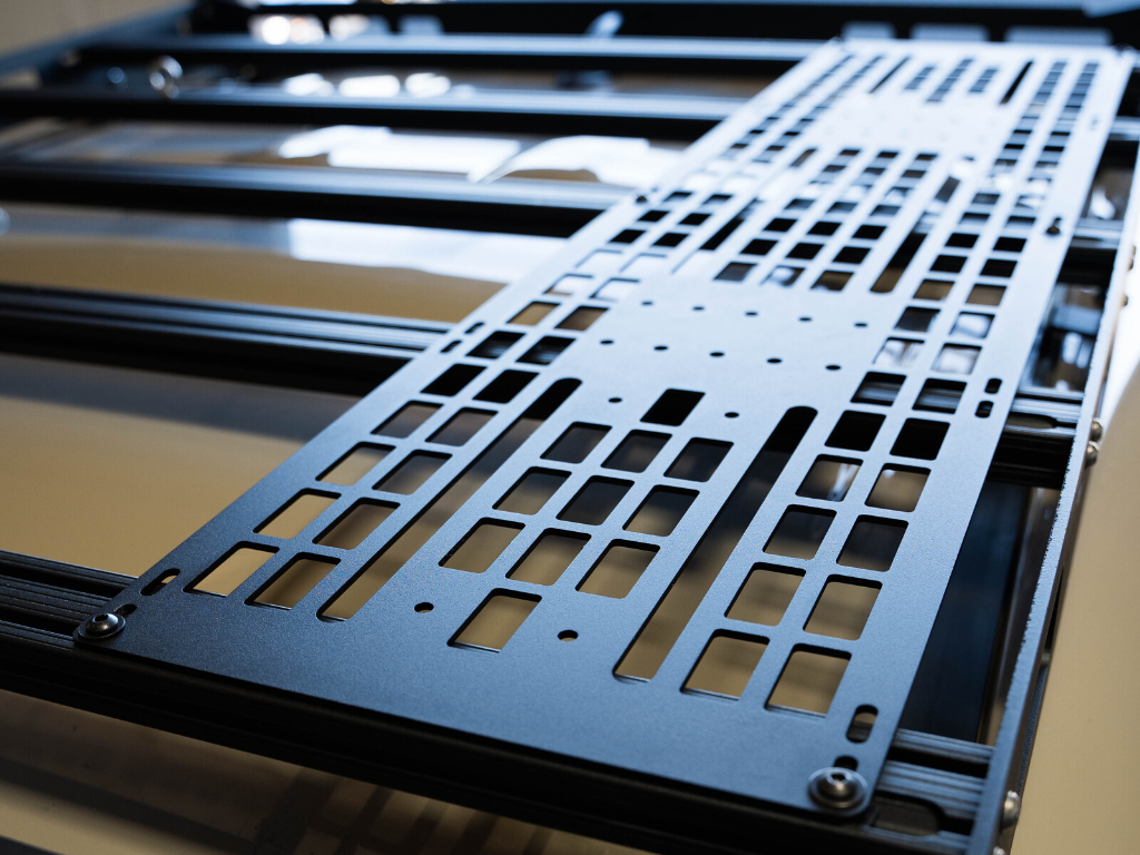 Black modular roof rack mounting panel for overlanding vehicles, close-up view