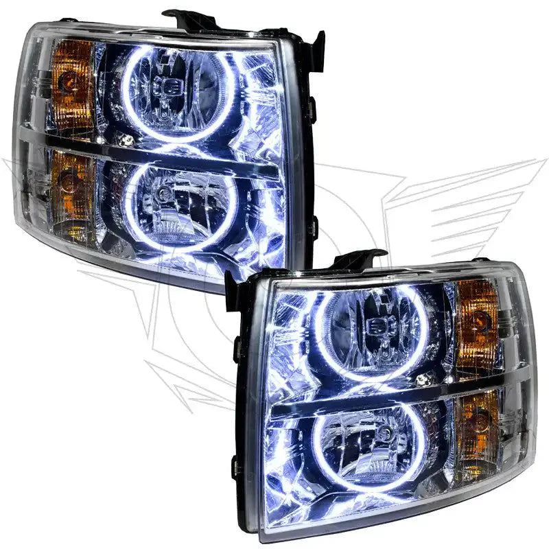 Pair of aftermarket LED halo projector headlights for Toyota Tacoma, clear lens with amber corners