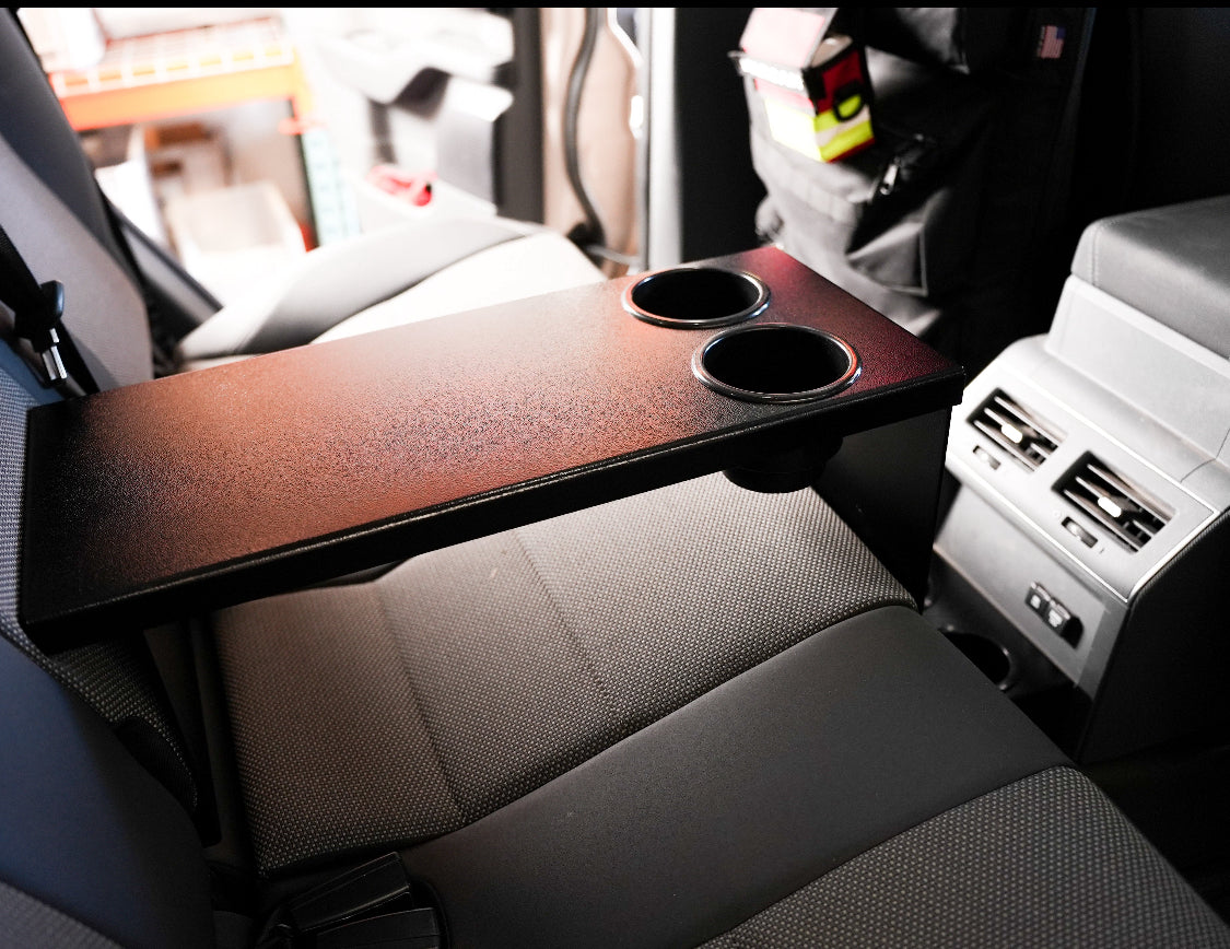 Diabolical Inc rear seat armrest with cup holders in an Ineos Grenadier