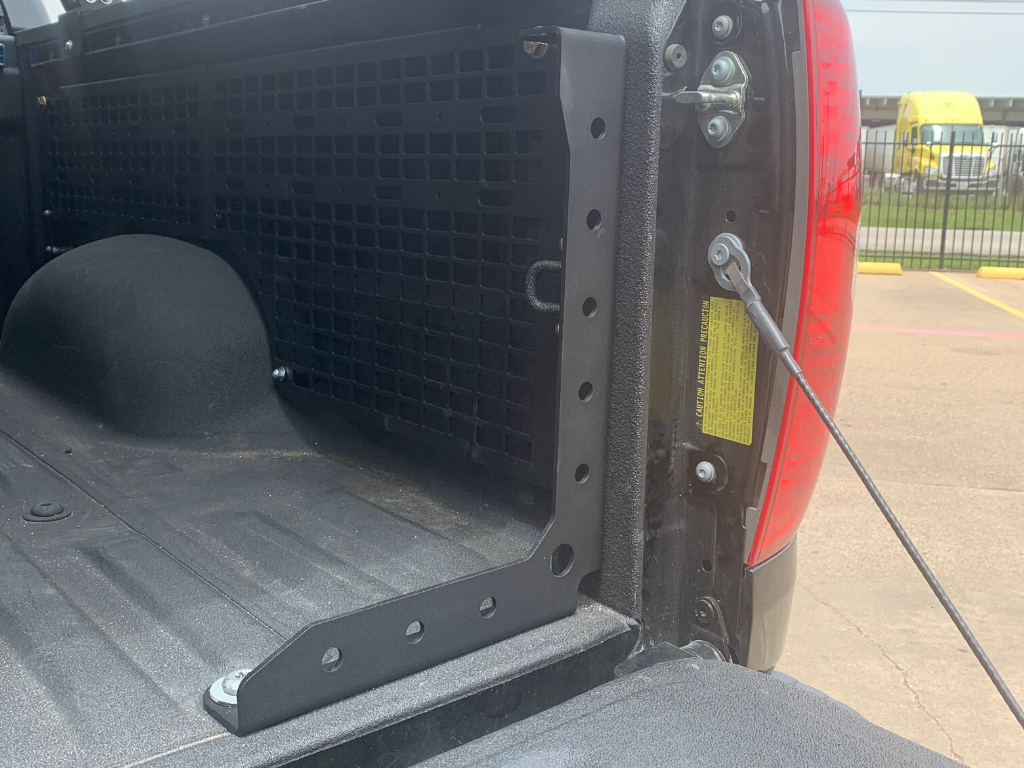 Truck bed panel and mounting bracket for overlanding storage in pickup vehicle