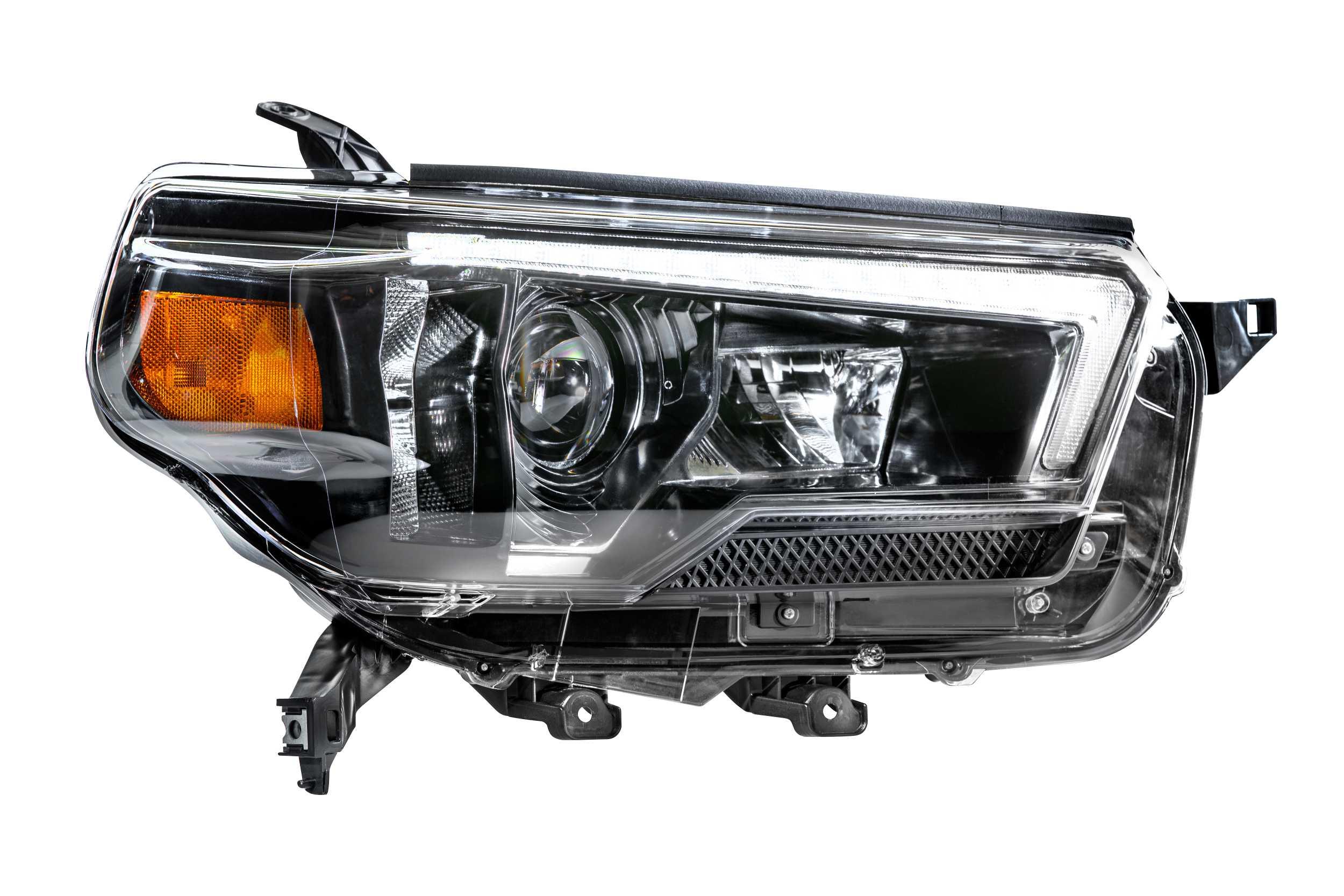 Clear view of a Toyota Tacoma headlight assembly with amber and LED components