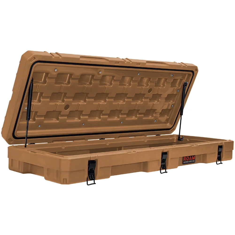 Tan overland rooftop cargo storage case with open lid and secure latches