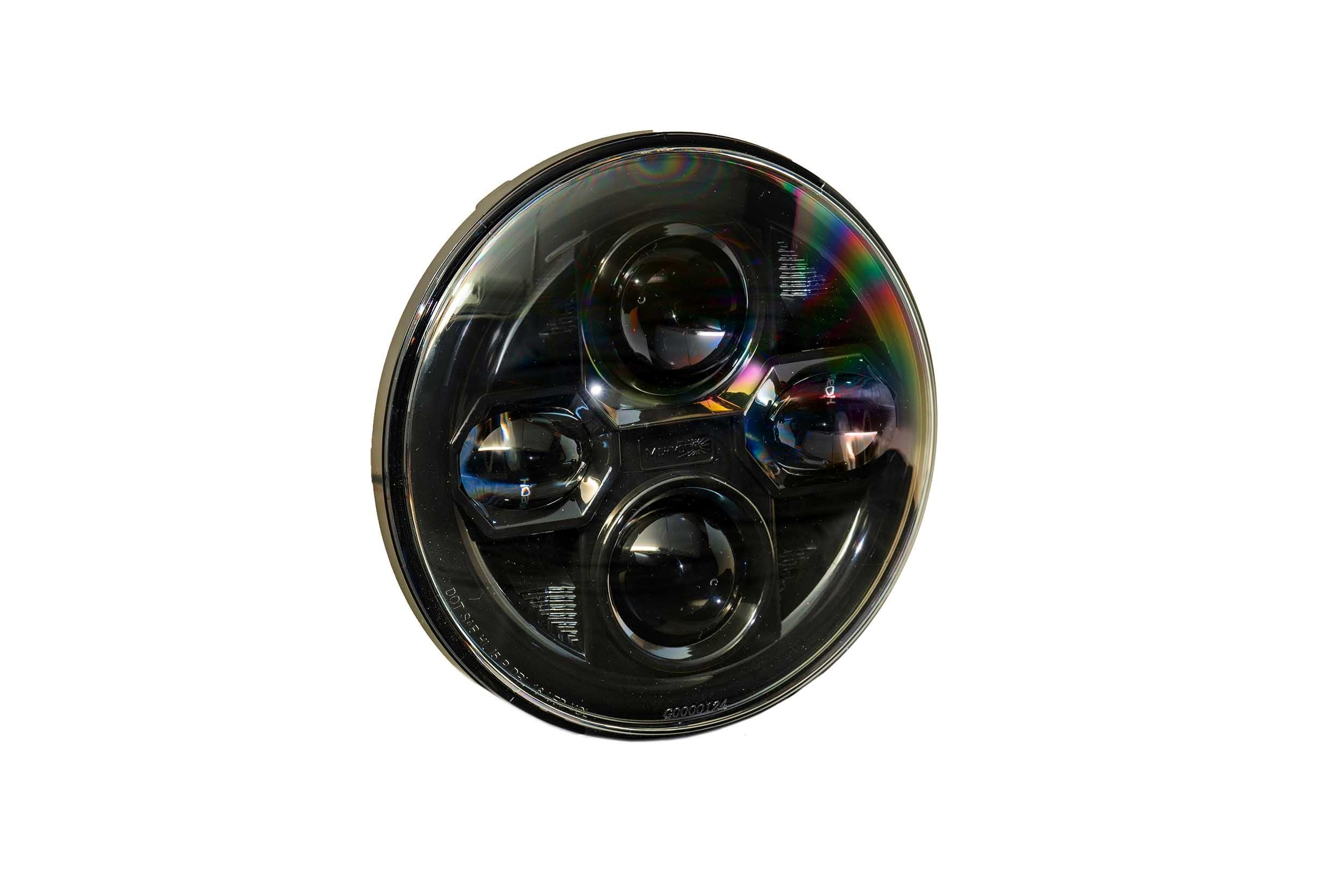 Round LED off-road vehicle headlight with black housing and clear lens, isolated on white