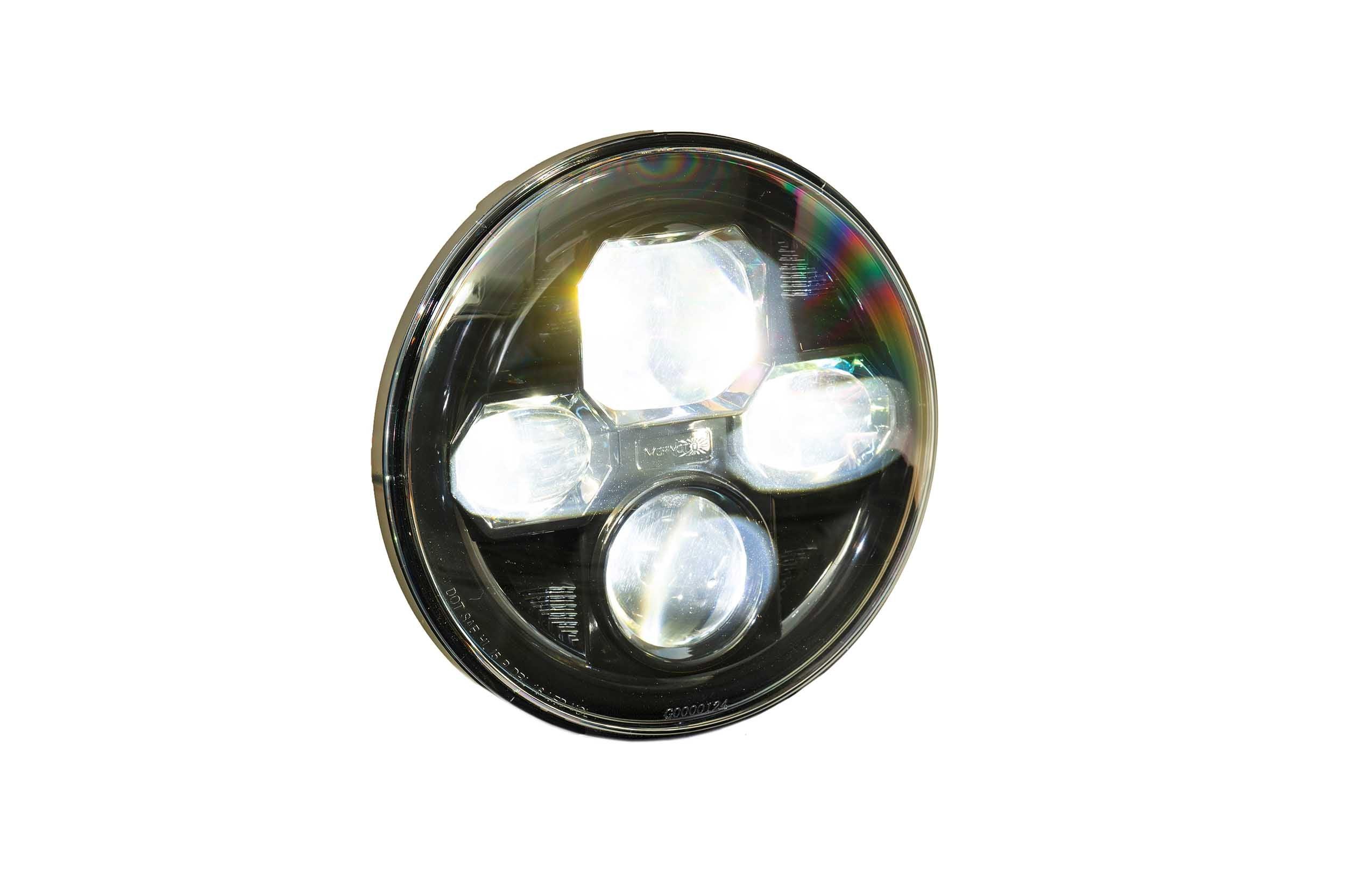 Round LED headlight for off-road vehicles, clear lens, black housing, isolated on white