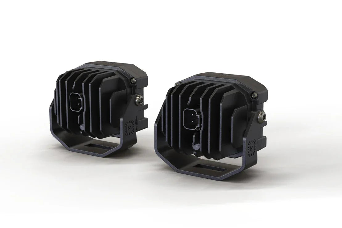 Pair of black off-road LED pod lights with heat sink fins for trucks and SUVs