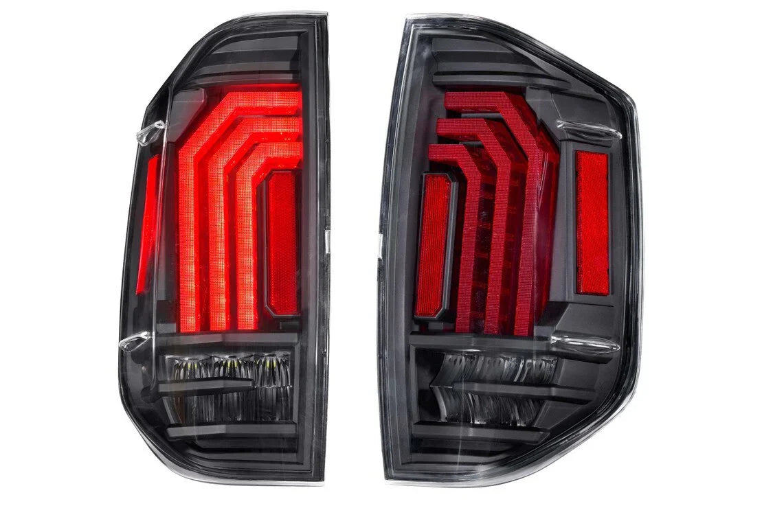 Pair of black LED aftermarket tail lights with red accents for Toyota Tacoma trucks