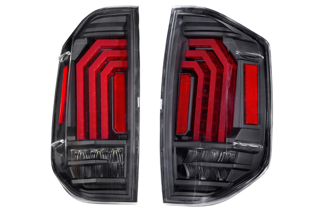 Pair of modern LED tail lights with red accents for off-road or overlanding vehicles