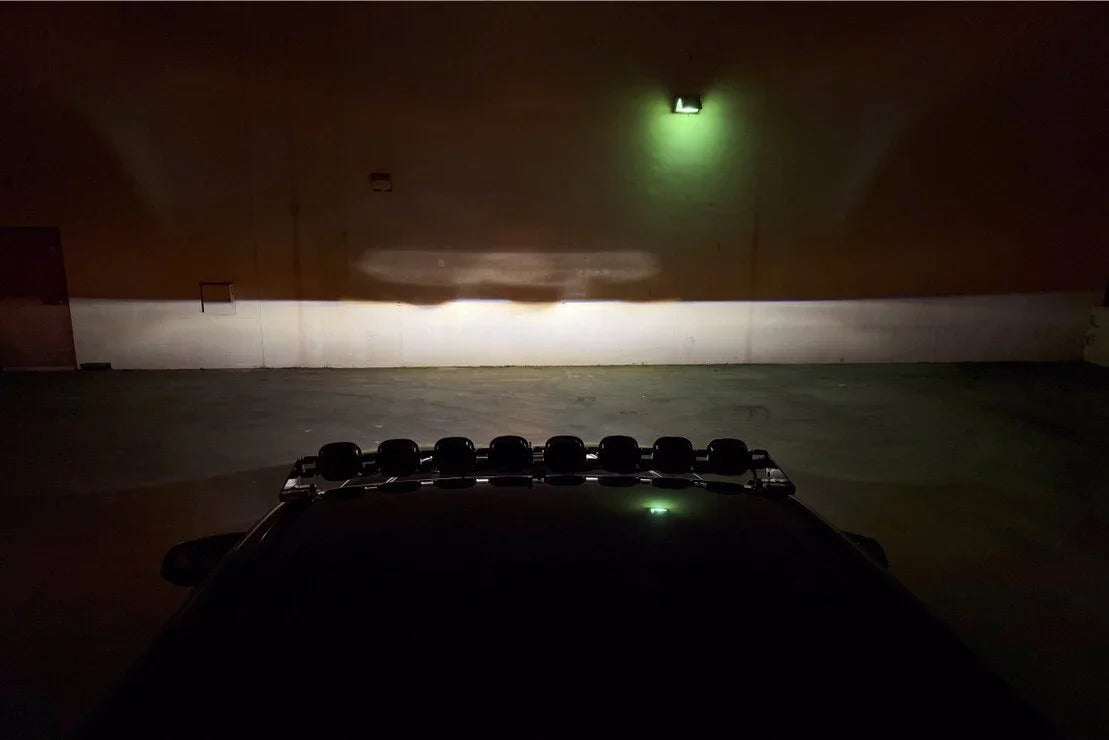 Toyota Tacoma XB Evo LED headlights night beam pattern projected on wall for overlanding