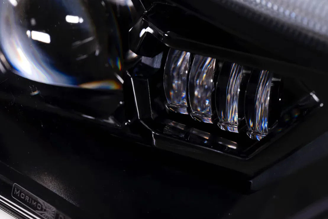 Close-up of LED projector headlight with clear lens for off-road vehicle