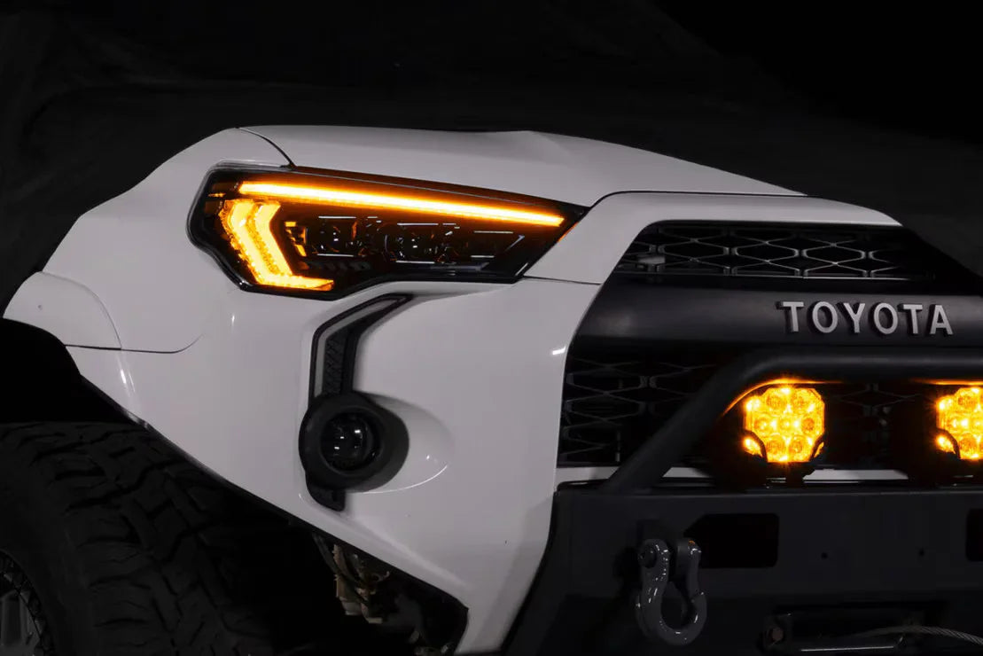 Toyota 4Runner LED headlights and off-road bumper with amber lights, night close-up
