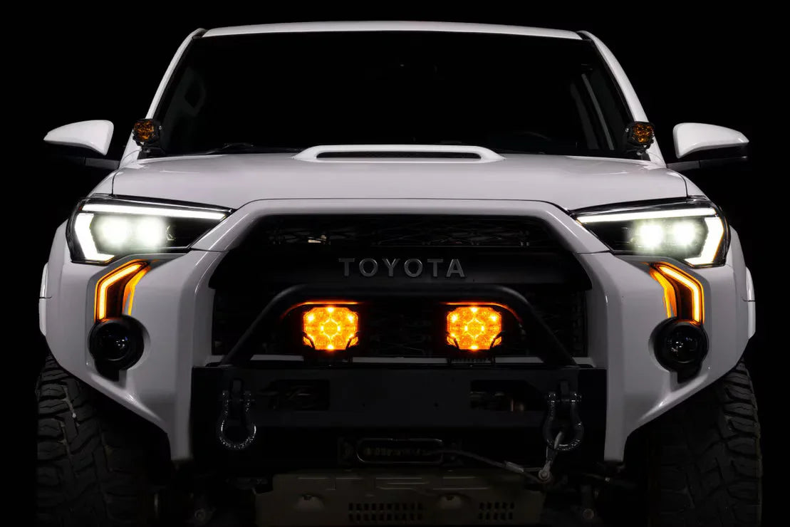 Toyota 4Runner front view with off-road bumper, LED lights, and grille lights illuminated