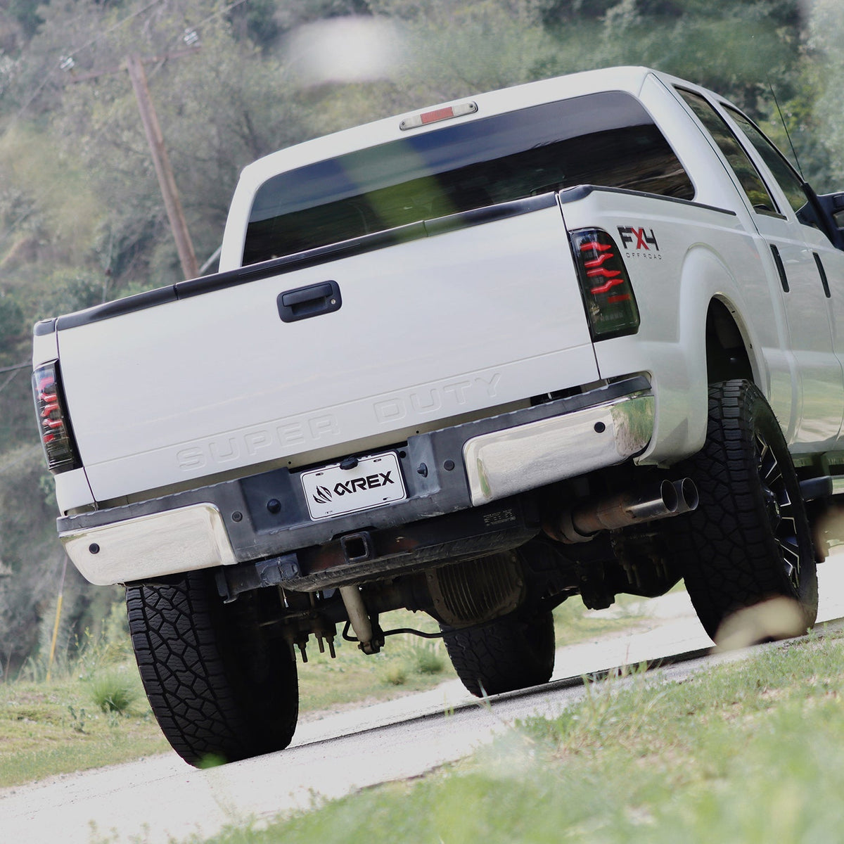 AlphaRex LUXX-Series LED Tail Lights for Ford Super Duty / Ford F-150 - Black Smoke