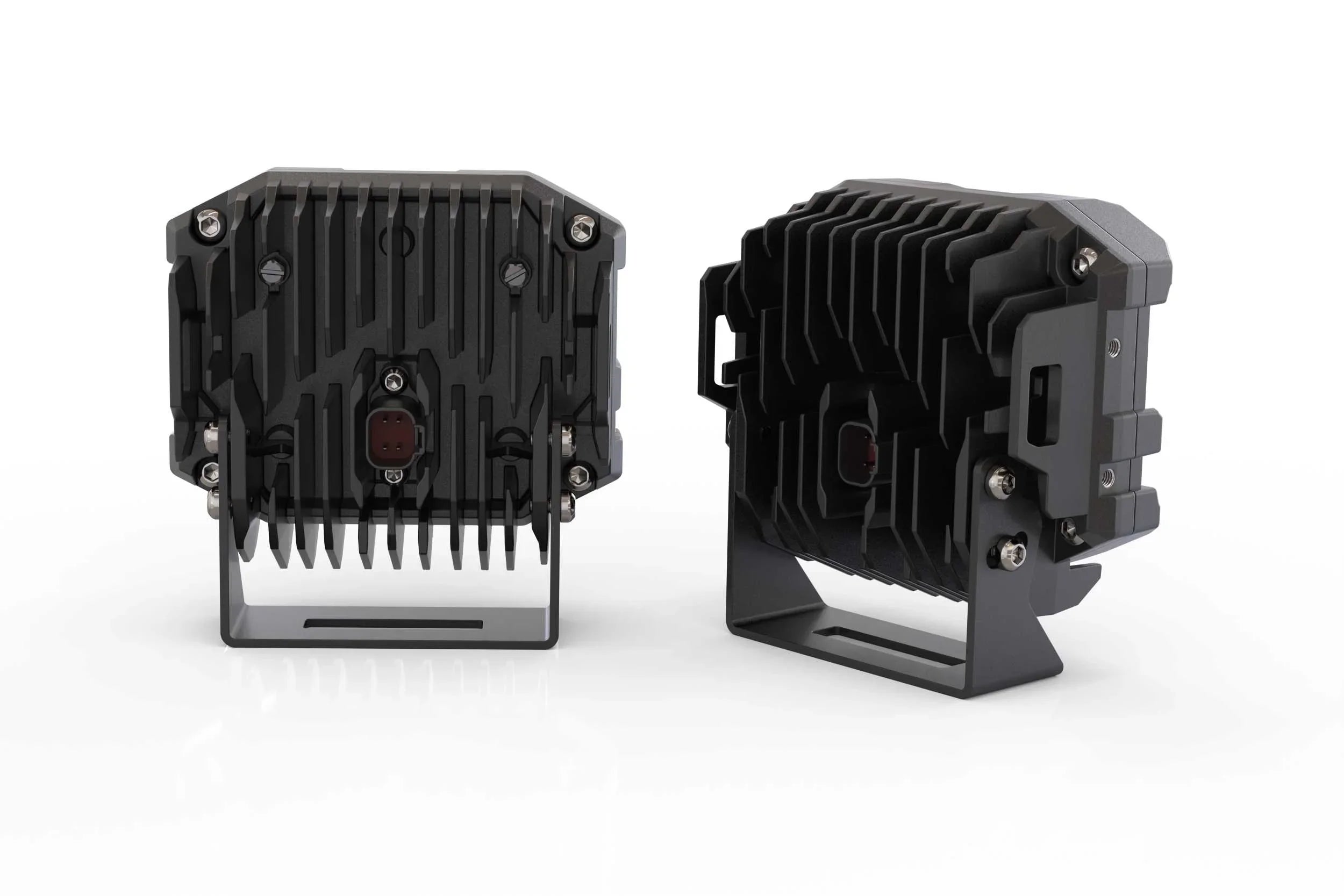 Pair of rugged LED off-road light pods with heat sink fins and mounting brackets, rear view
