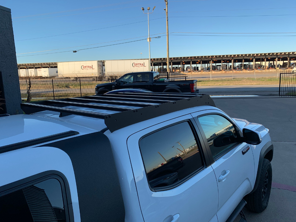 Toyota Tacoma with heavy-duty roof rack for overlanding and camping gear