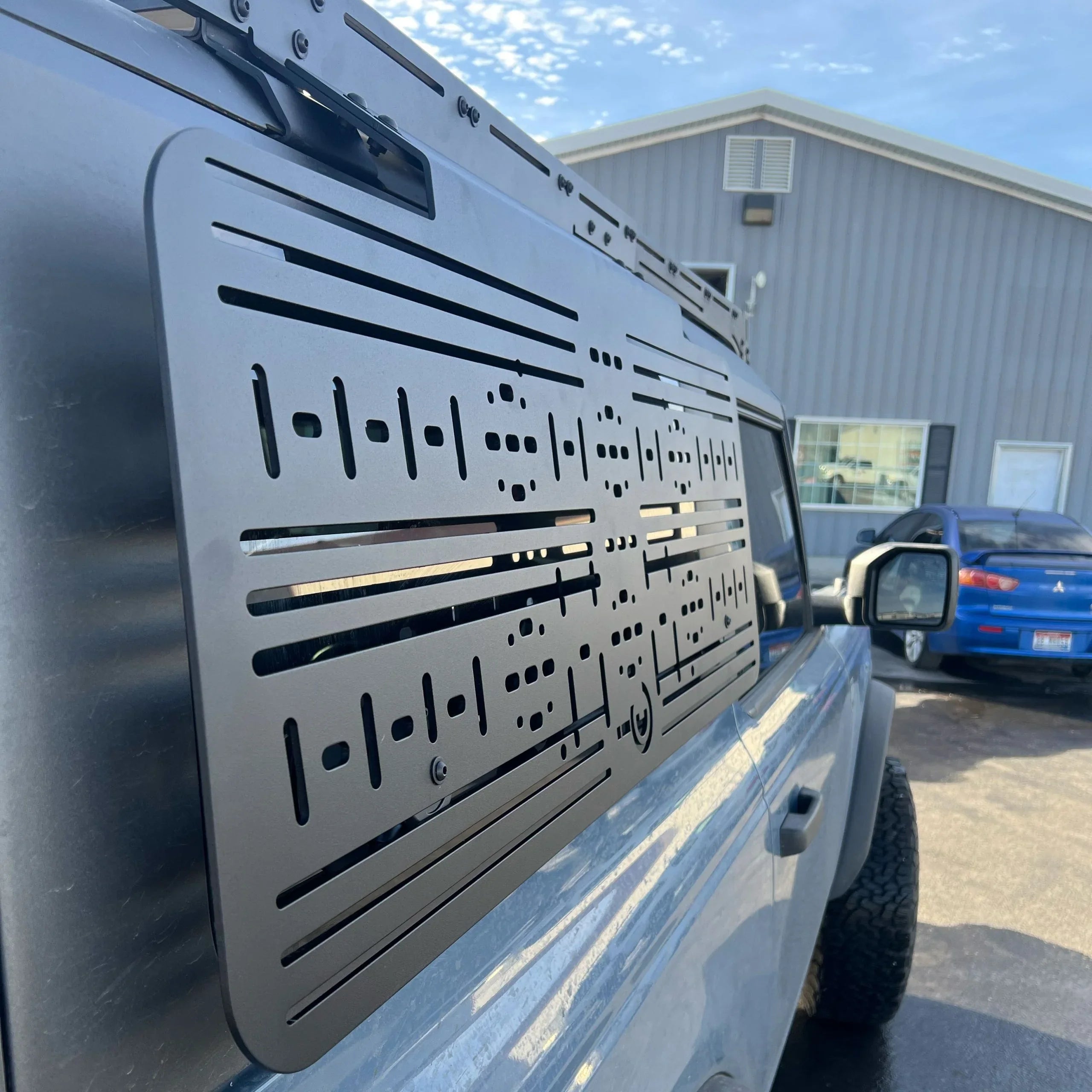 Ford Bronco side panel molle system accessory installed for overlanding gear storage