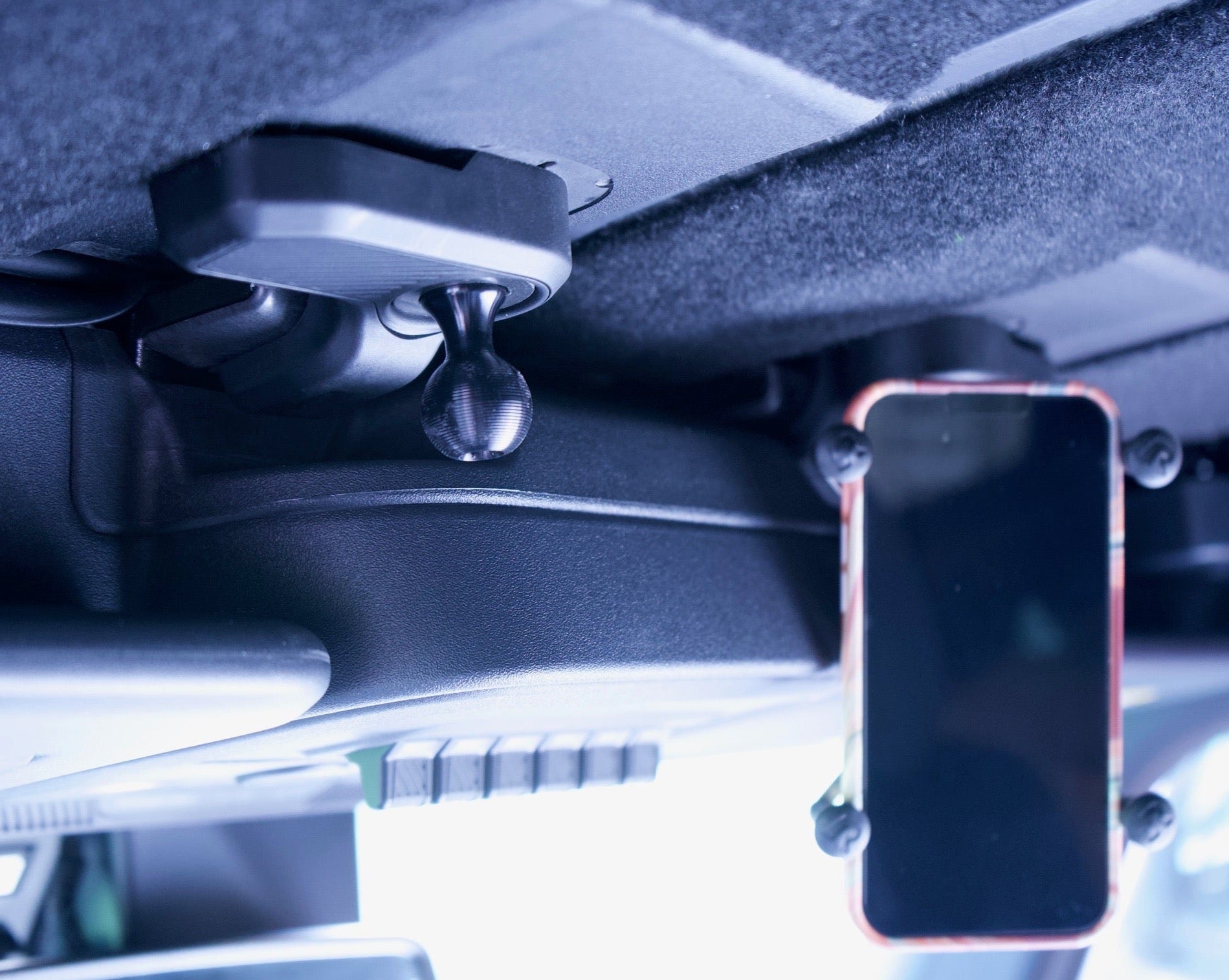Bronco Freedom Panel ball mount with X-Grip phone holder installed inside vehicle