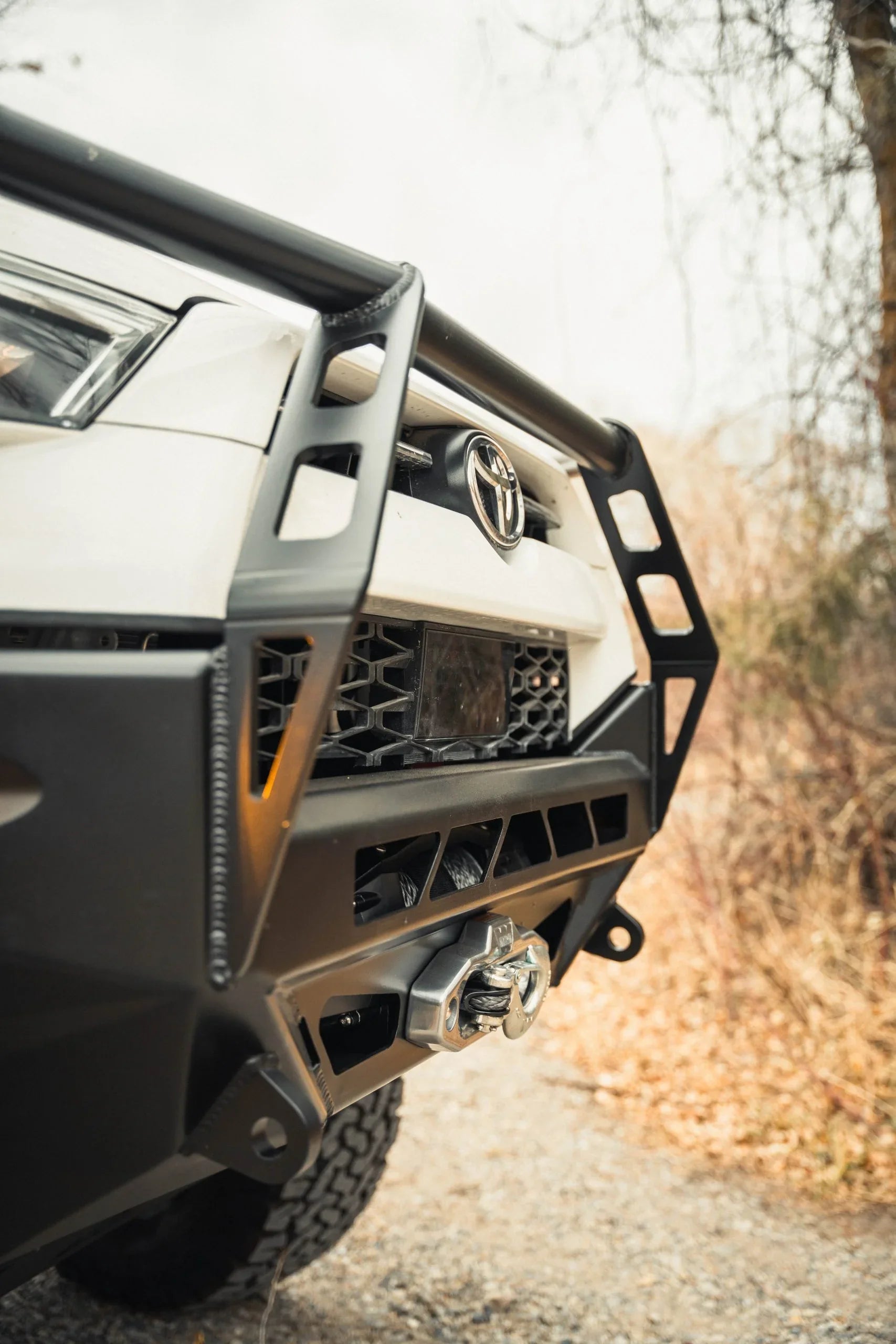 Adventure front bumper with winch on Toyota 4Runner parked outdoors