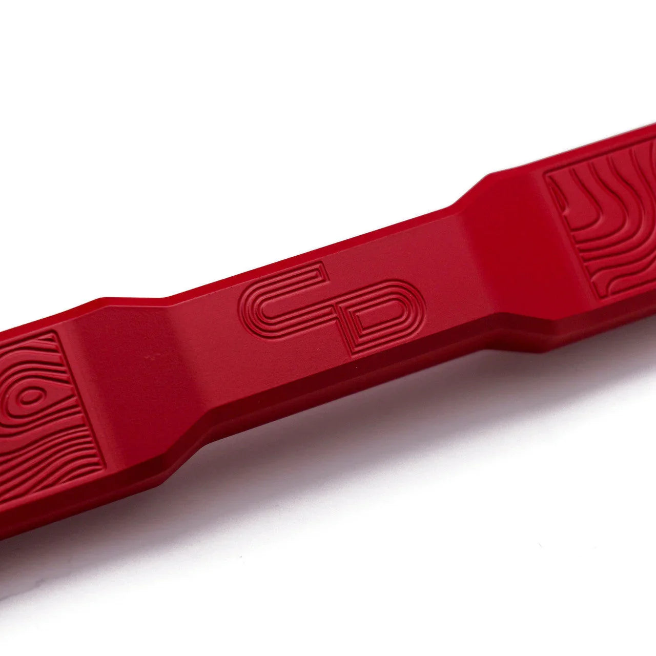 Red billet aluminum battery tie down for Toyota or Lexus with etched pattern details