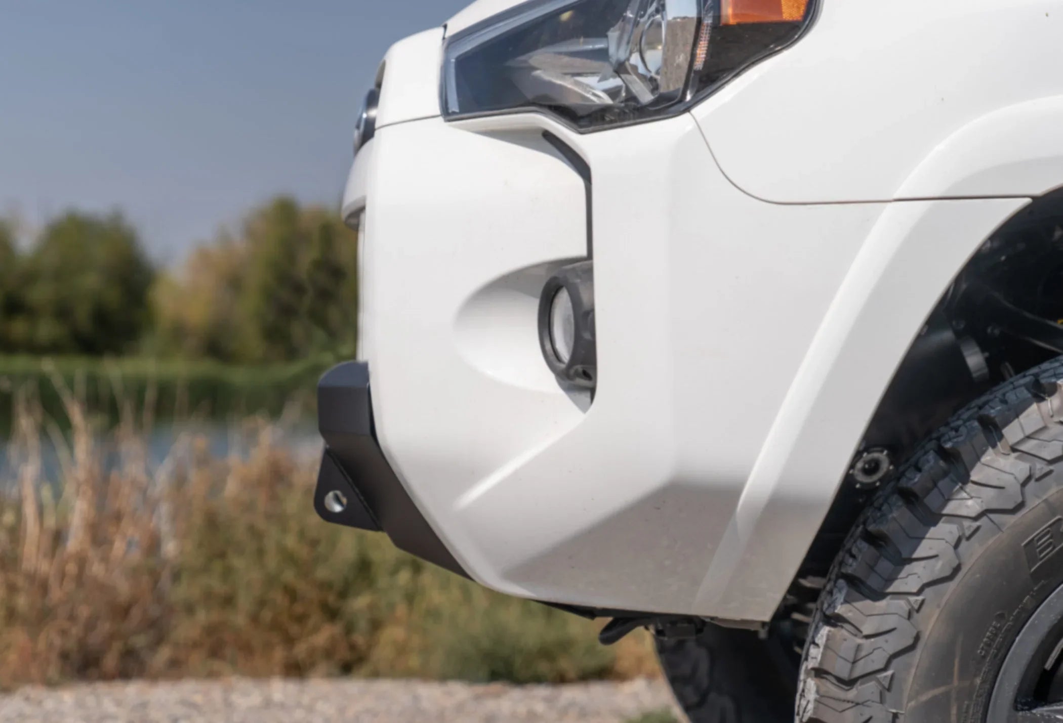 White Toyota 4Runner with CBI Offroad steel front bumper and all-terrain tires